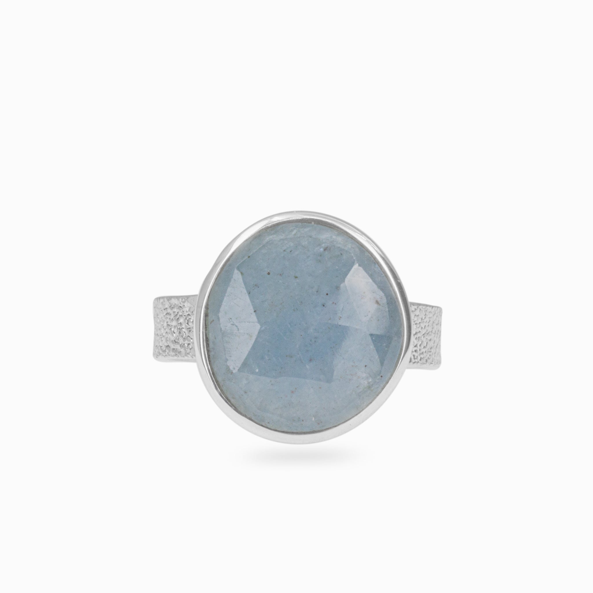 aquamarine checkerboard faceted ring with hammered hand