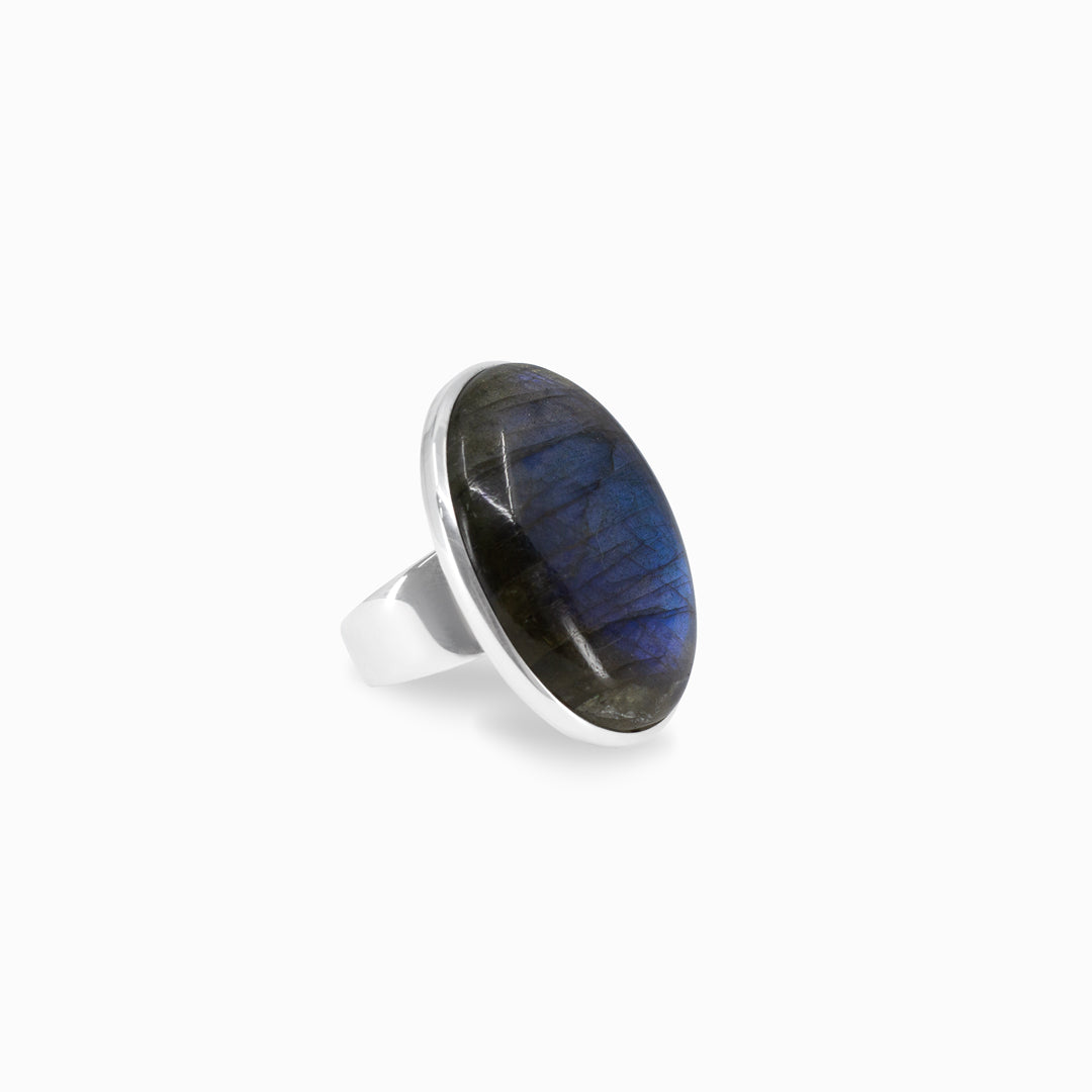 Silver ring with blue stone on a white background