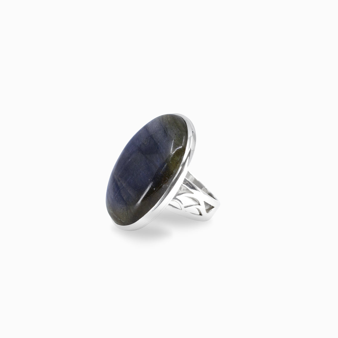 Silver ring with blue stone on a white background