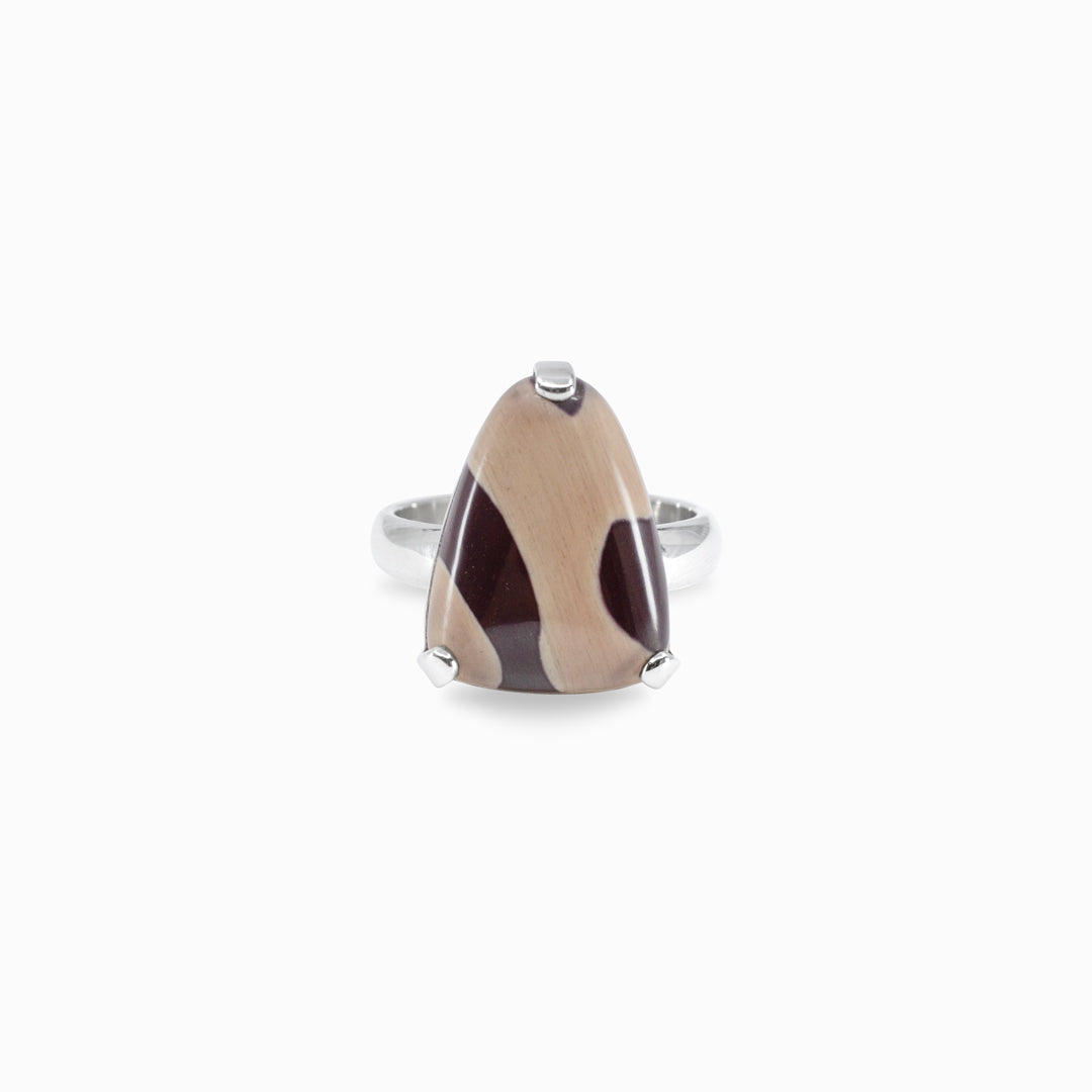 Silver ring with brown pattern on a white background