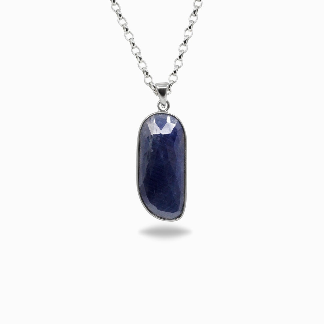 Necklace with a freeform blue pendant on a white background