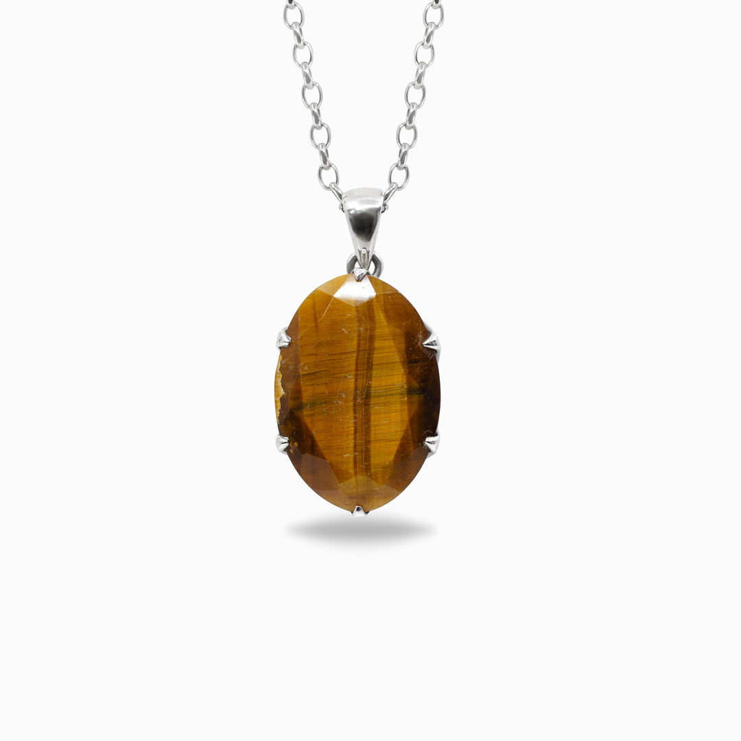 Tiger's eye pendant on a silver chain against a white background