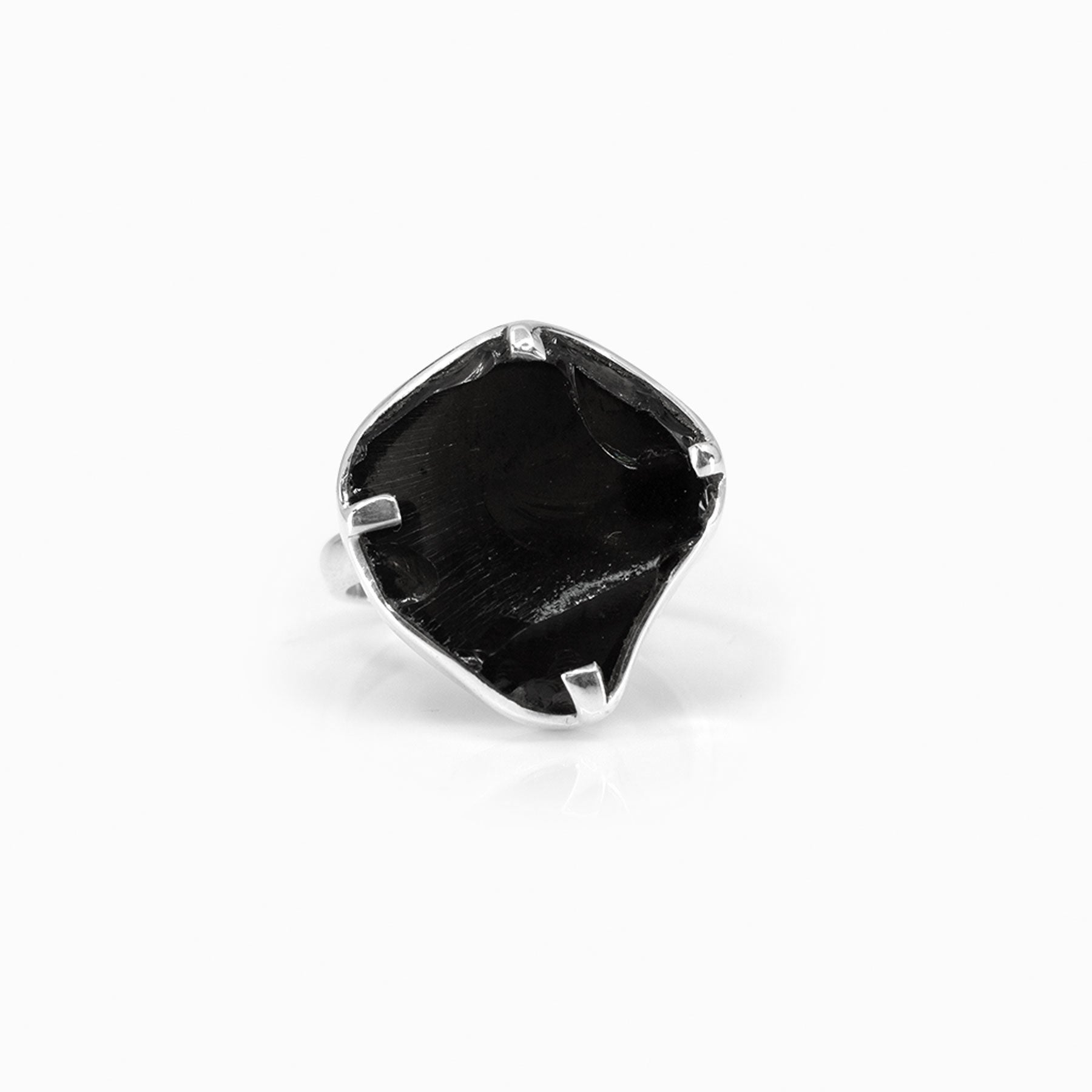 Silver ring with a black stone on a white background.