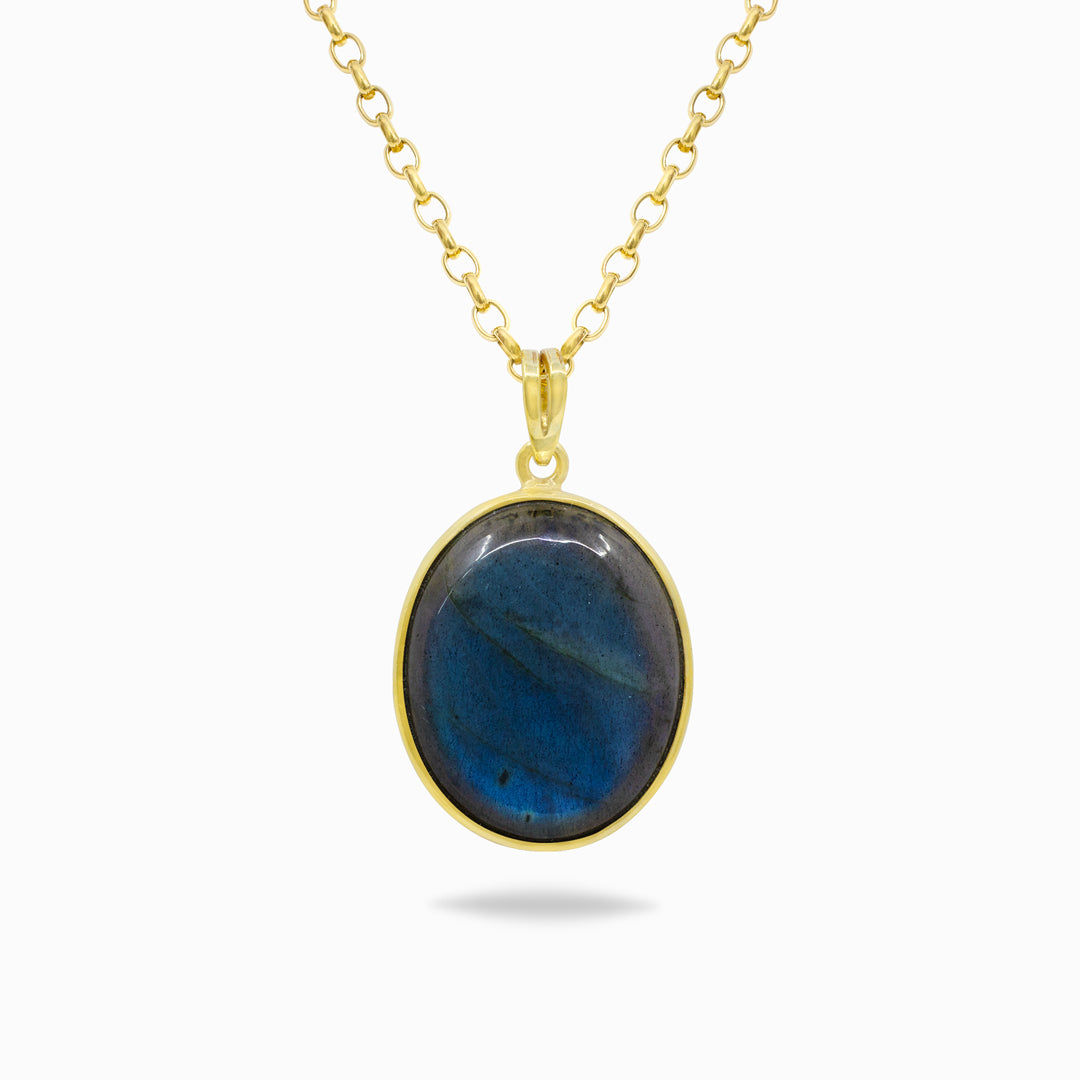 Golden necklace with a blue stone pendant on a white background