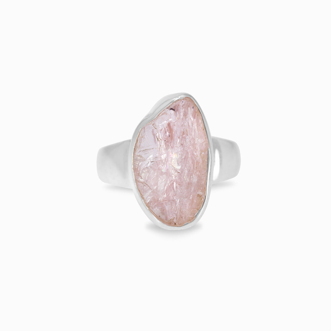 Silver ring with a pink stone on a white background