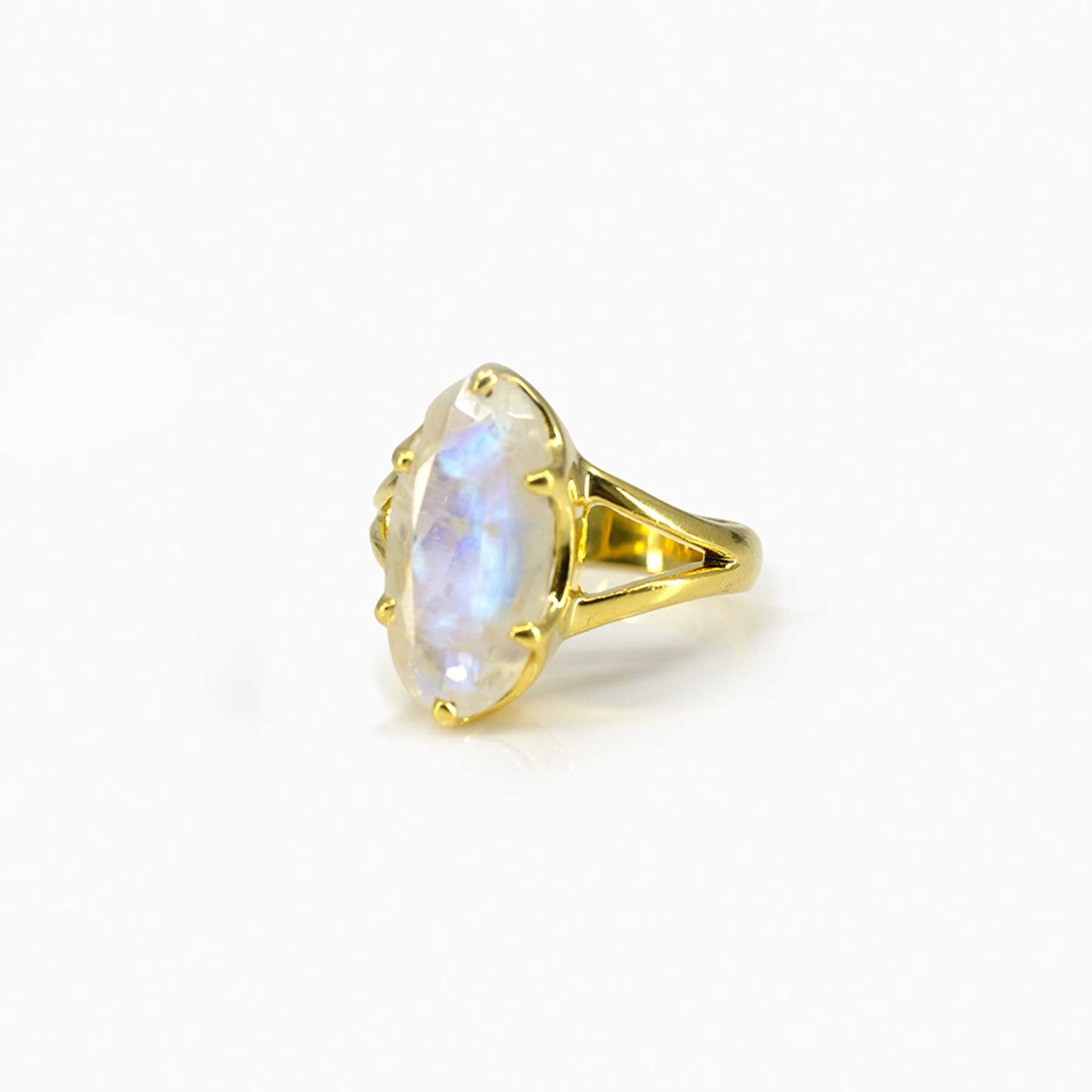 Gold ring with Moonstone on a white background