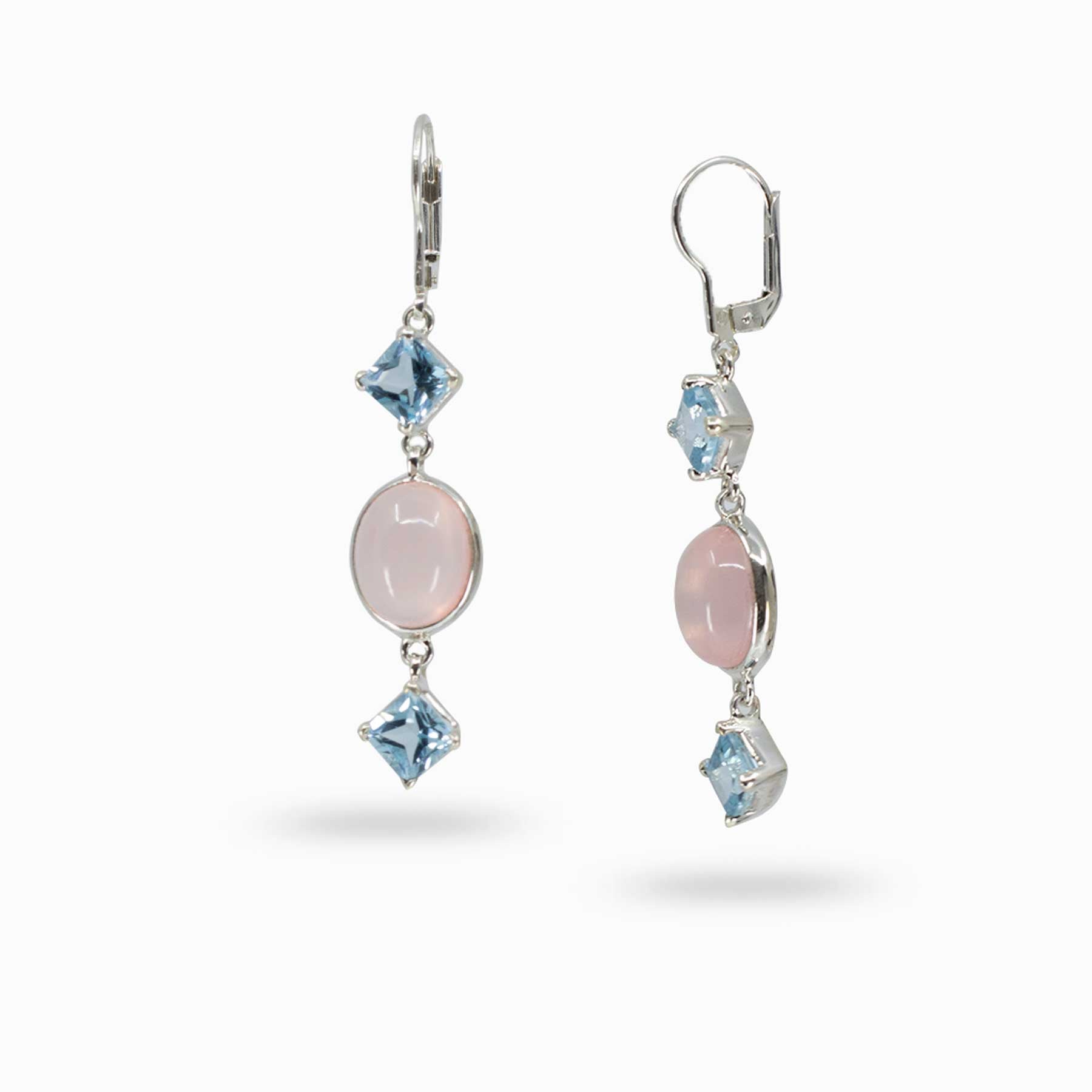 Pair of silver drop earrings with pink and blue gemstones on a white background