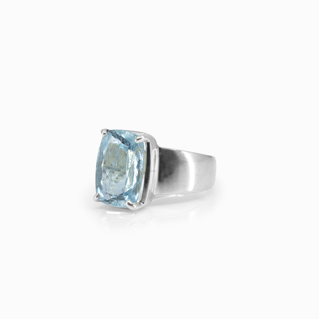 Silver ring with a blue gemstone on a white background