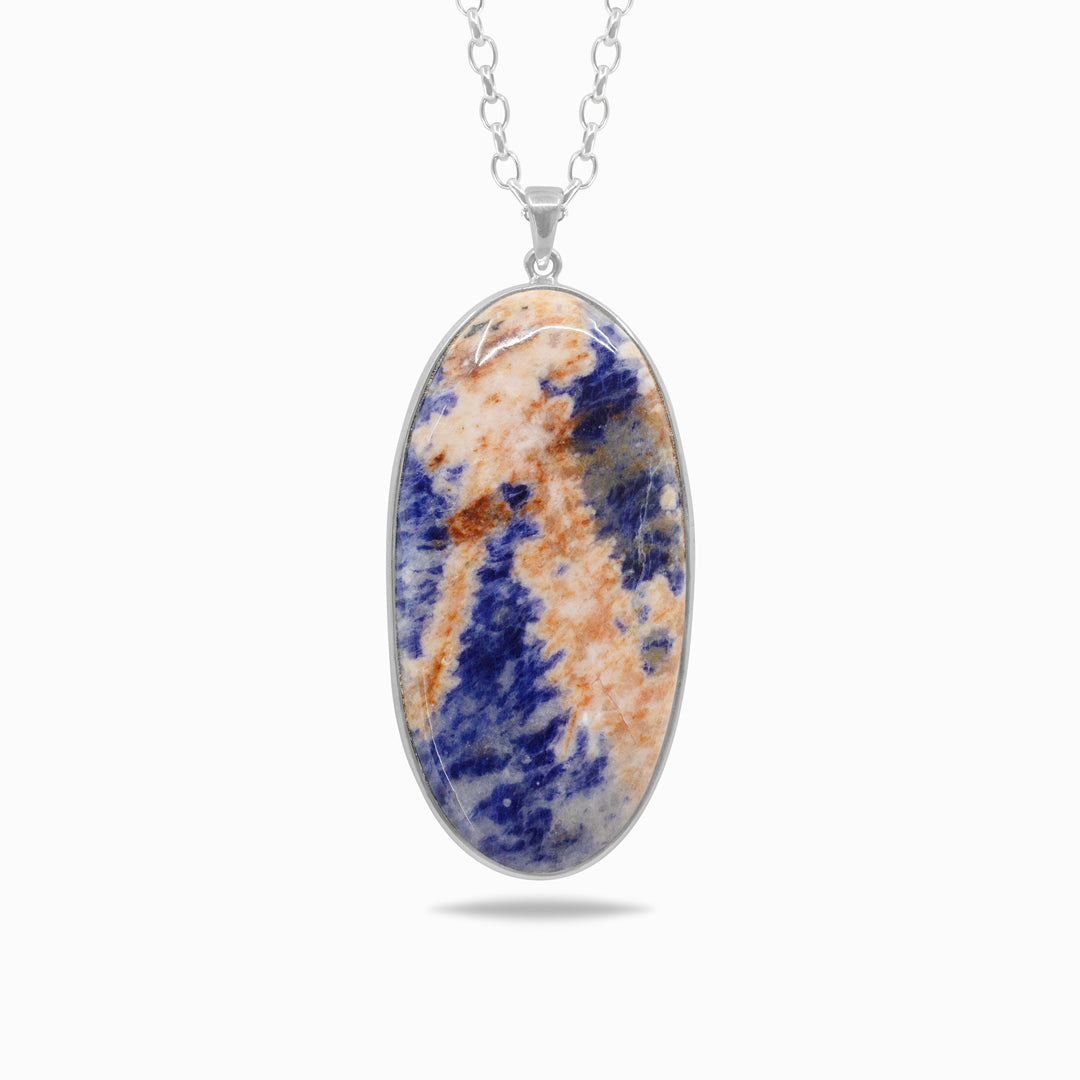 Silver necklace with an oval pendant featuring blue and orange patterns on a white background