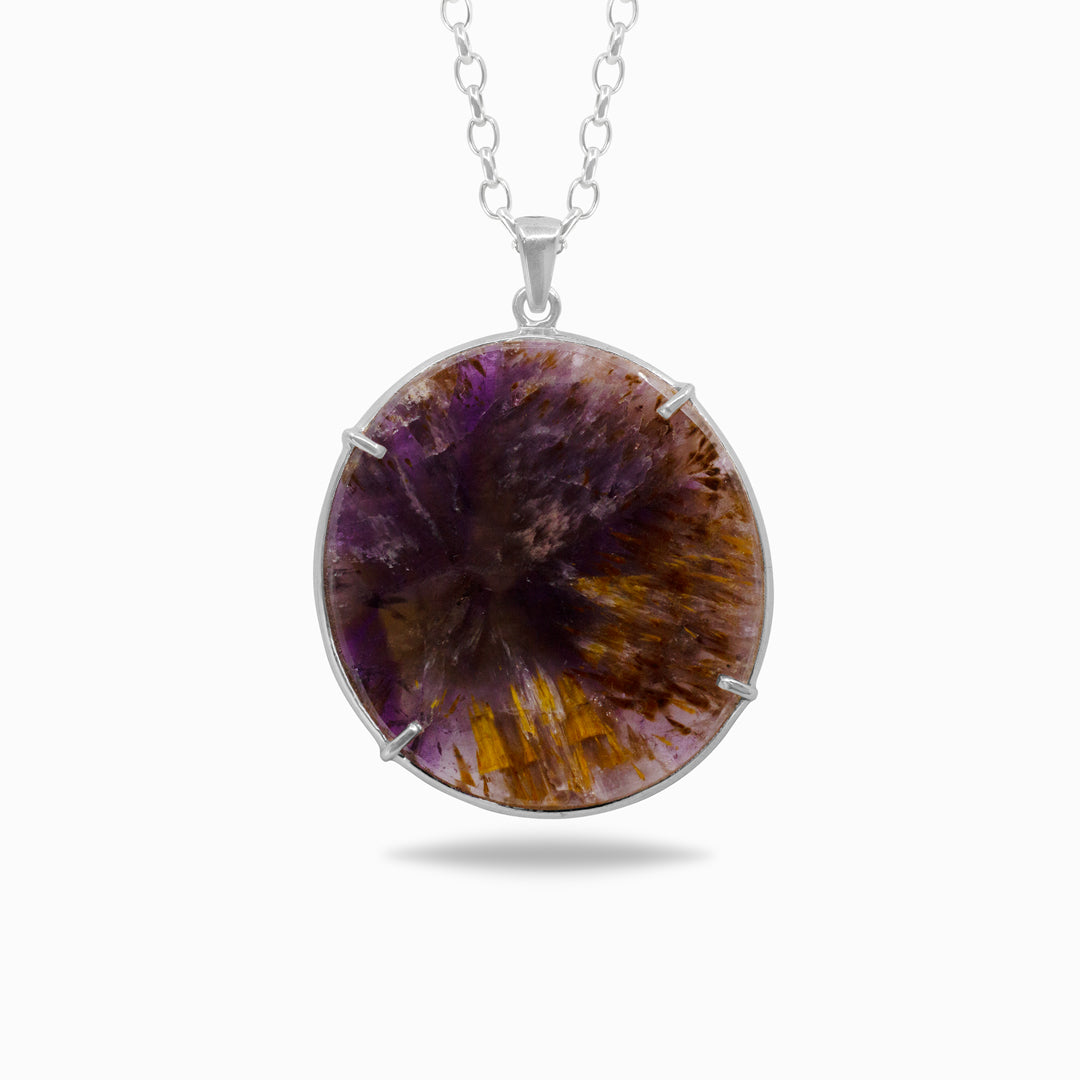 Silver necklace with a purple and yellow stone on a white background
