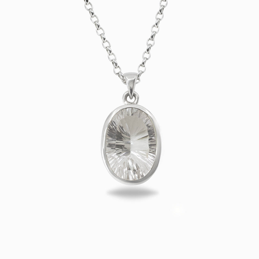 Silver pendant necklace with a clear gemstone on a white background