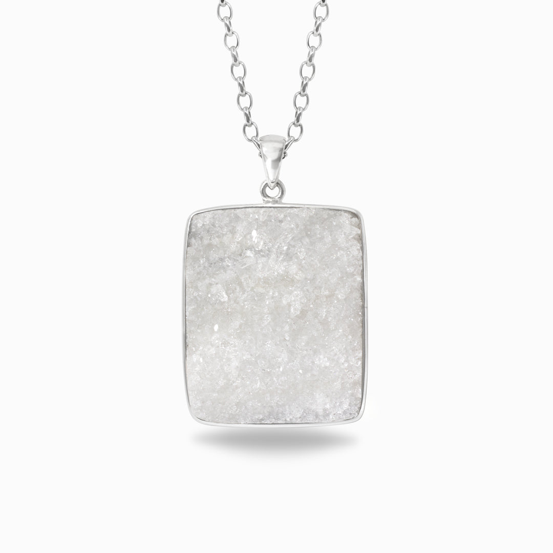 Rectangular silver pendant necklace on a white background