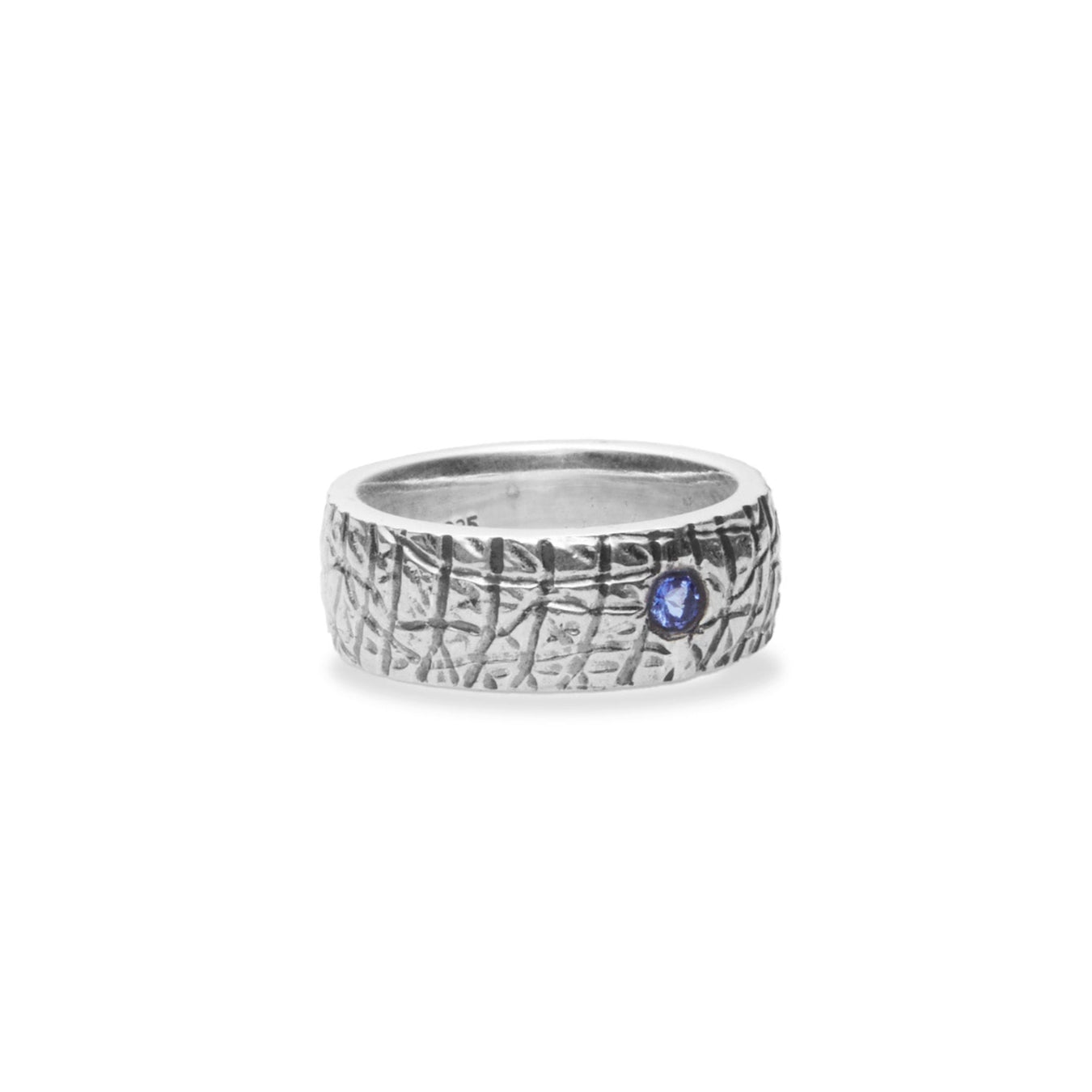 Tanzanite round faceted ring with sterling silver textured band side angle