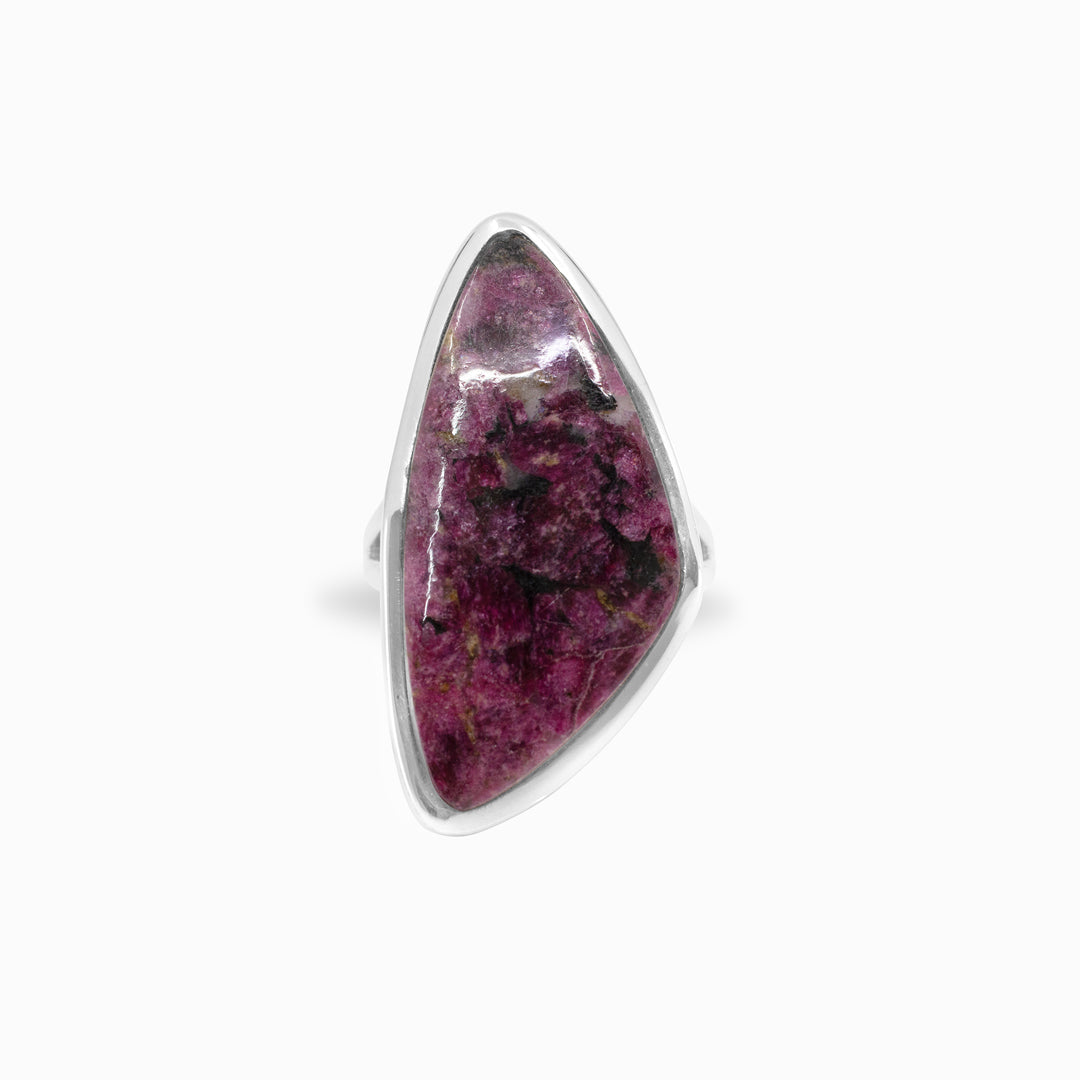 Silver ring with a freeform gemstone on a white background