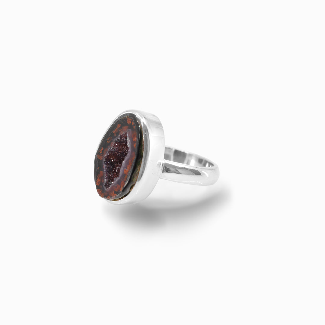 Silver ring with freeform druzy stone on a white background