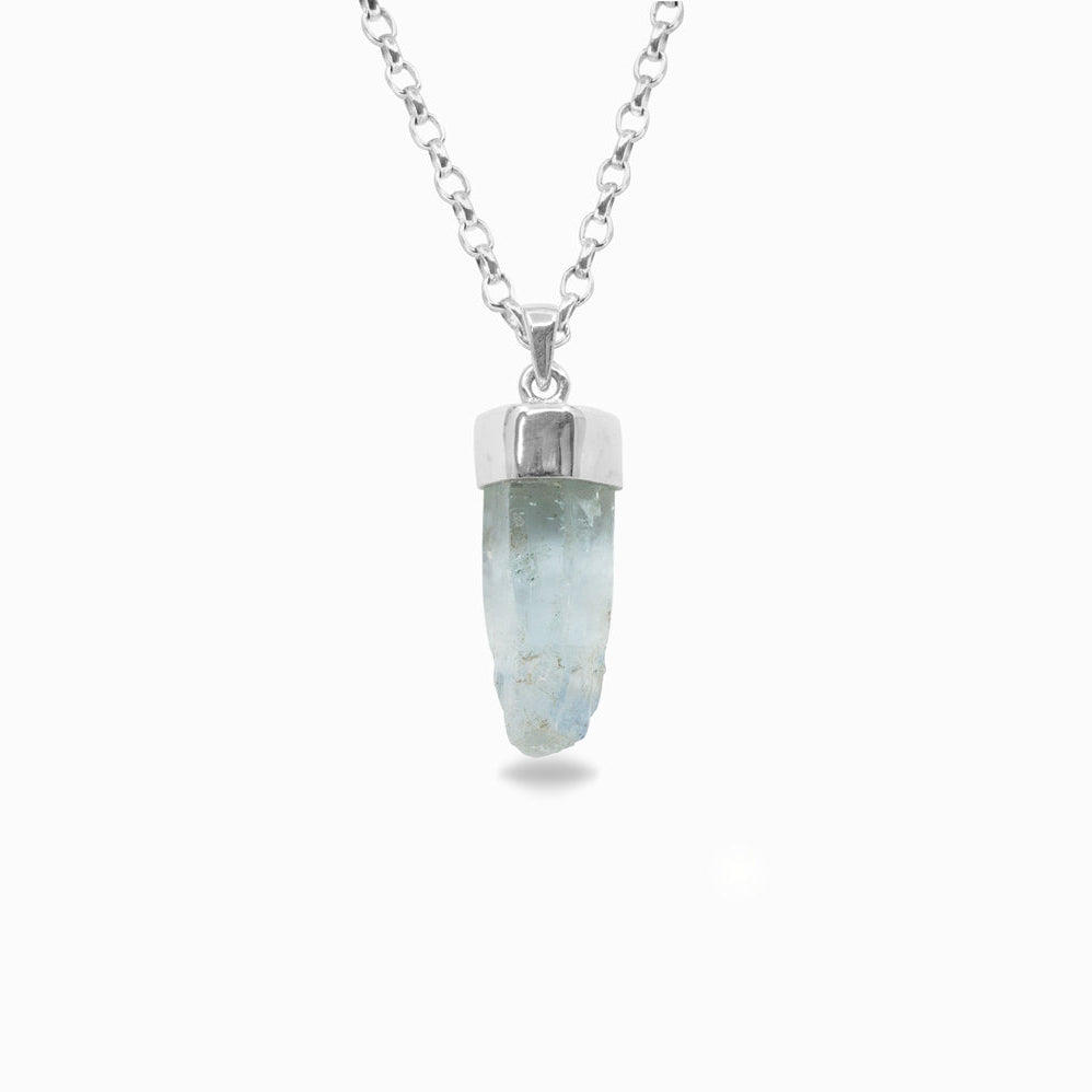 Silver necklace with a light blue crystal pendant on a white background