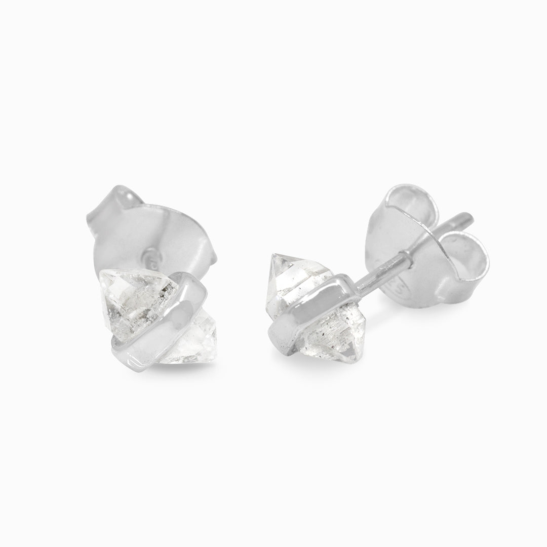 Pair of silver stud earrings with clear gemstones on a white background