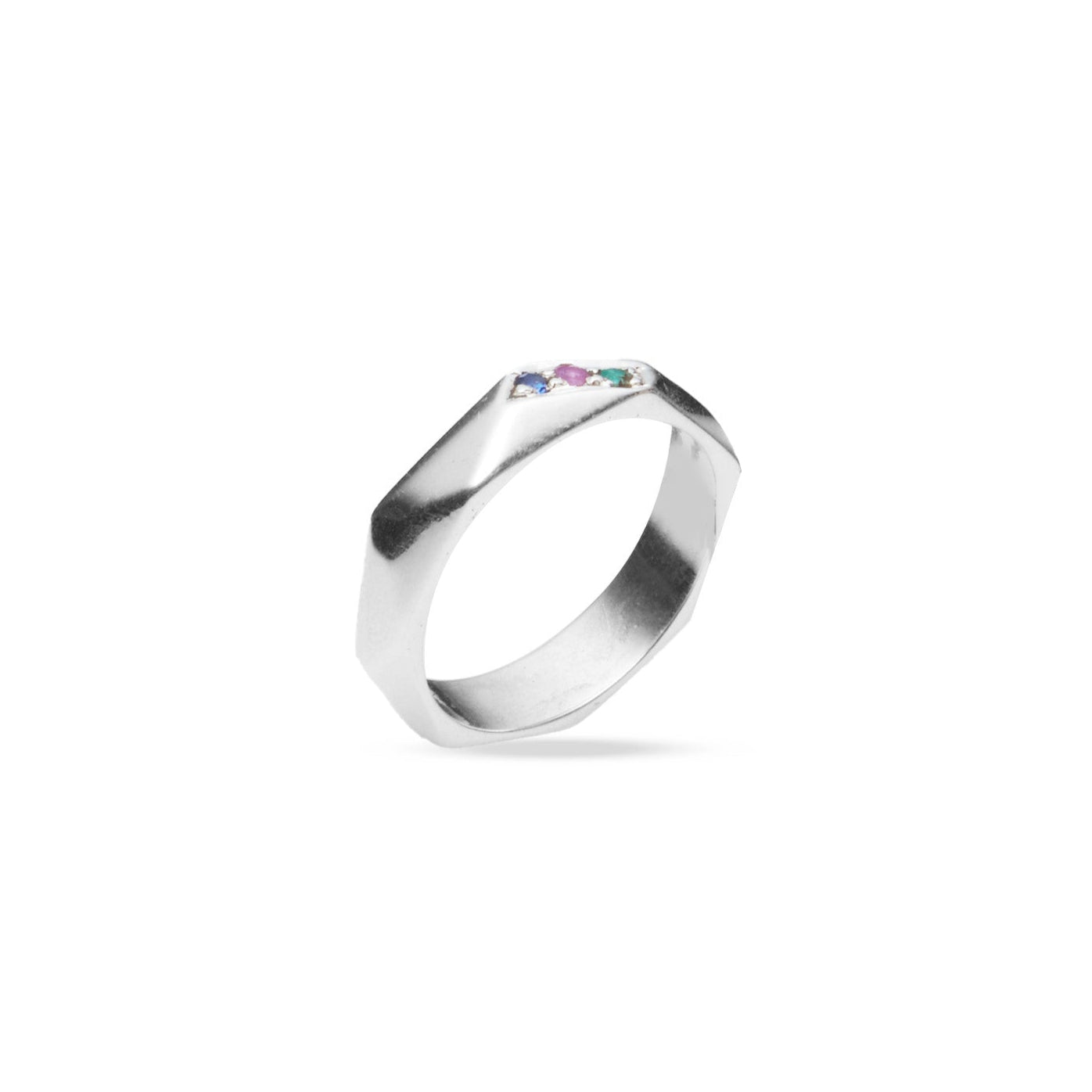 emerald sapphire ruby ring with hex cut band under angle