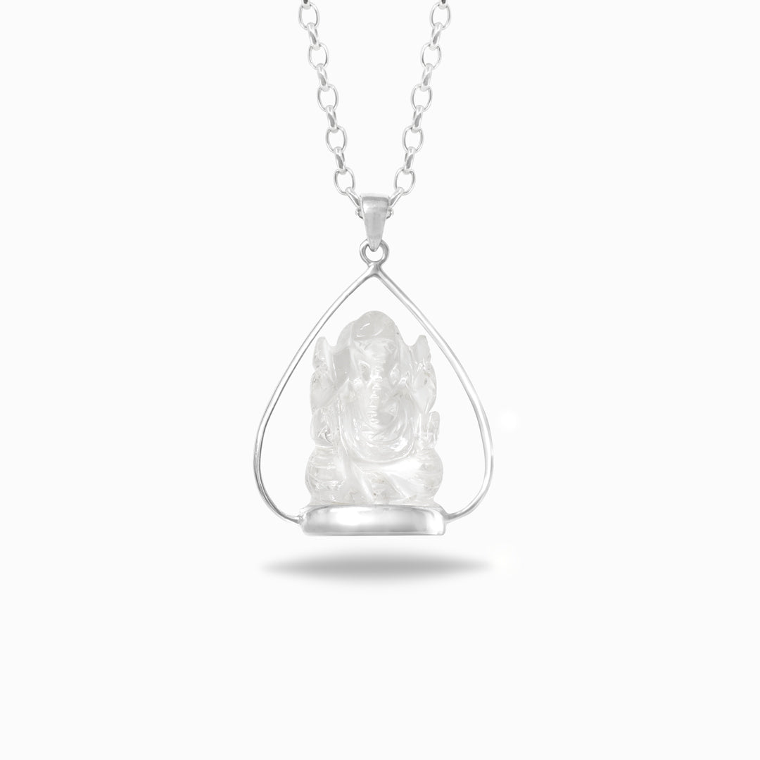 Silver pendant with a clear stone on a white background