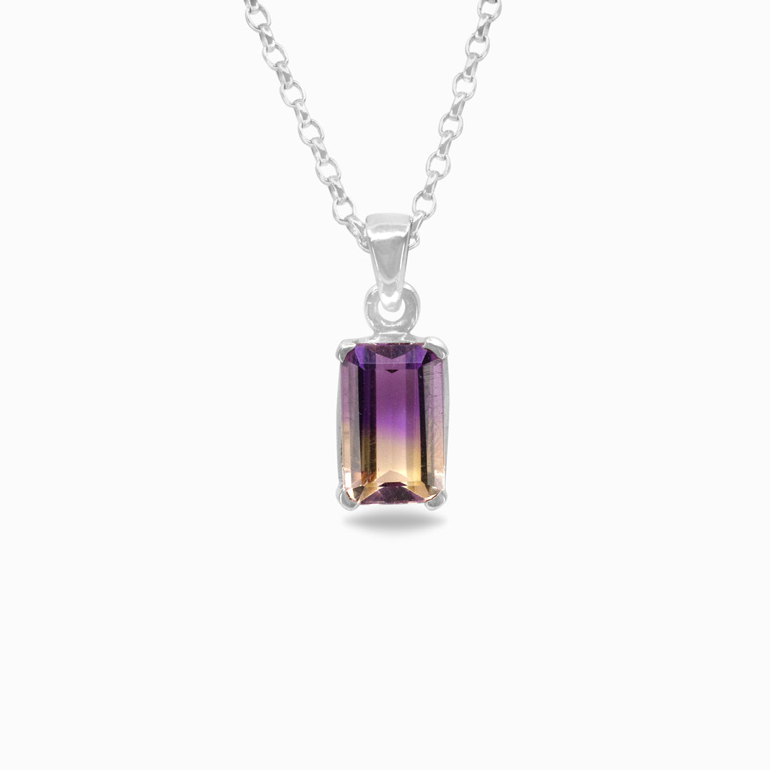 Silver necklace with a rectangular purple and yellow gemstone pendant on a white background