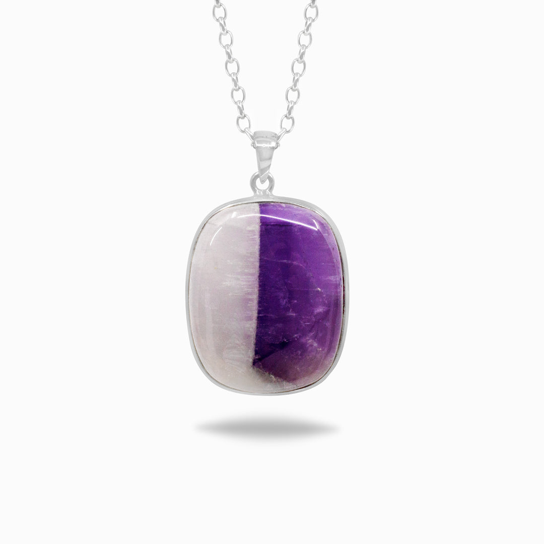 Silver necklace with a white and purple gemstone on a white background