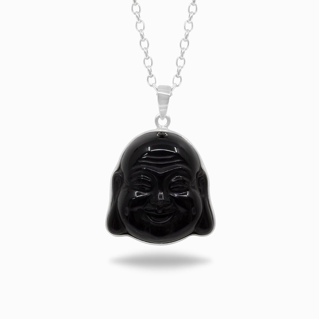 Black Buddha pendant on a silver chain against a white background