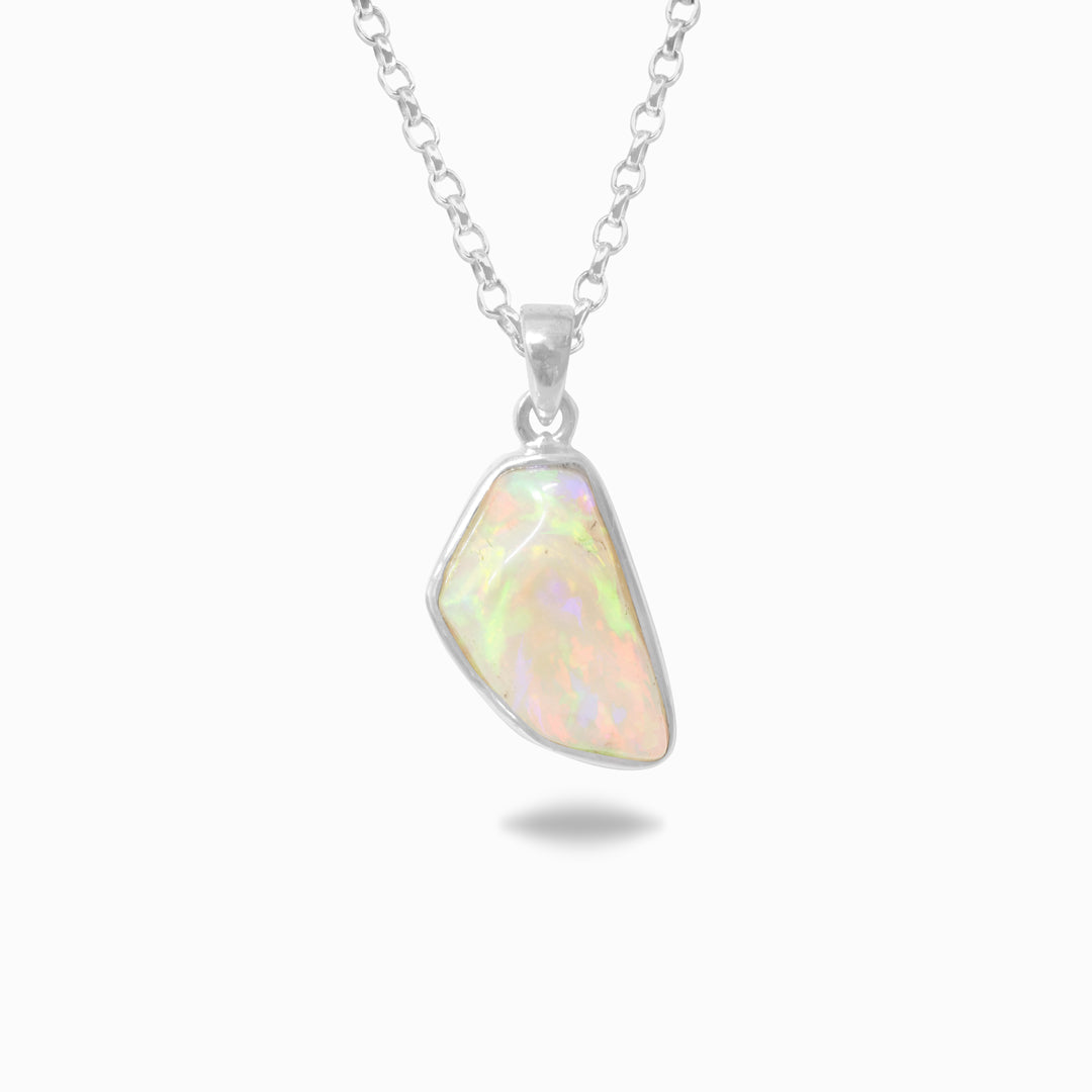 Opal pendant necklace on a white background