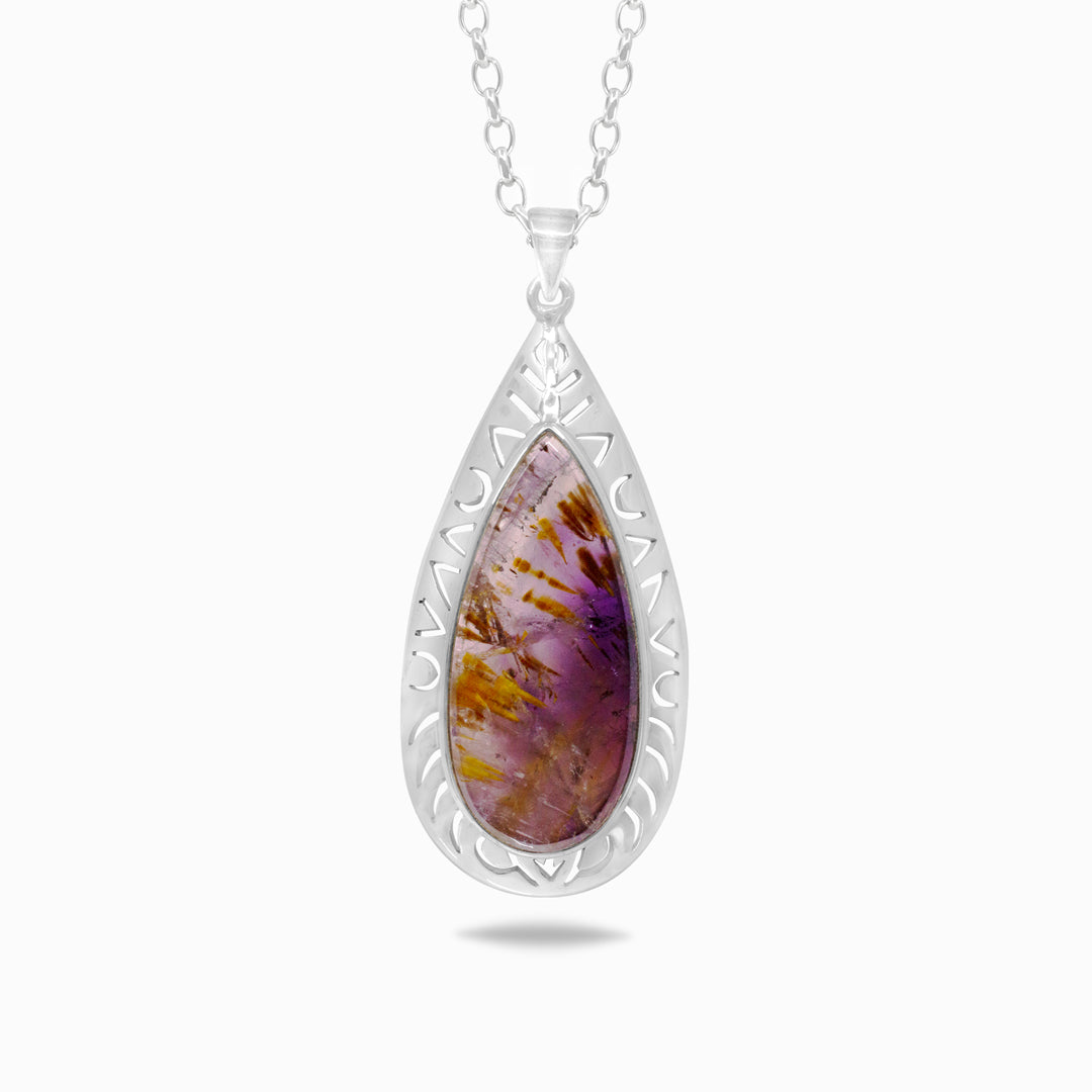 Teardrop-shaped pendant with purple gemstone and silver frame on a white background