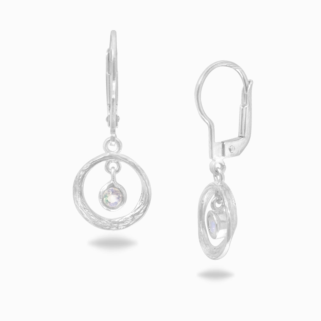 Pair of silver earrings with white gemstones and circular designs on a white background