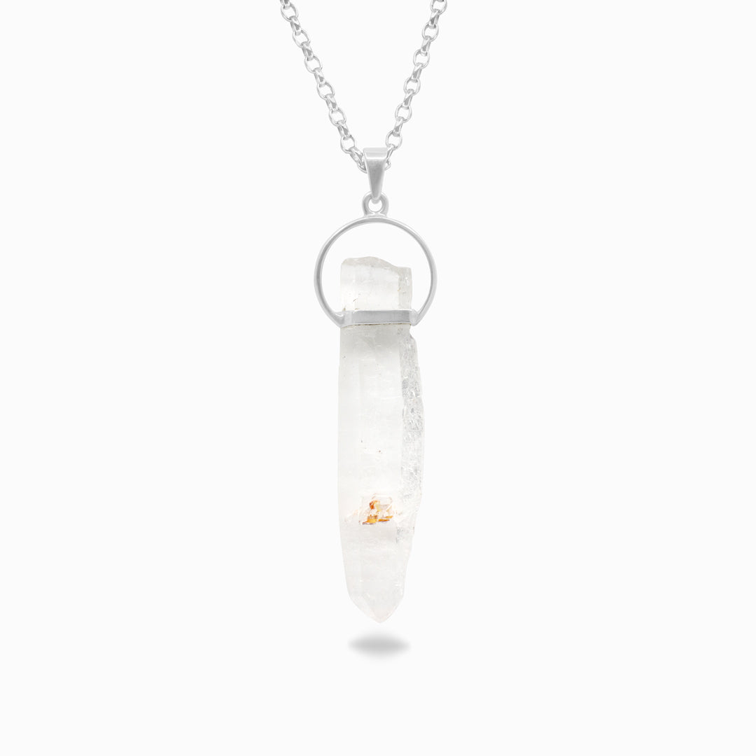 Silver necklace with a clear stone on a white background