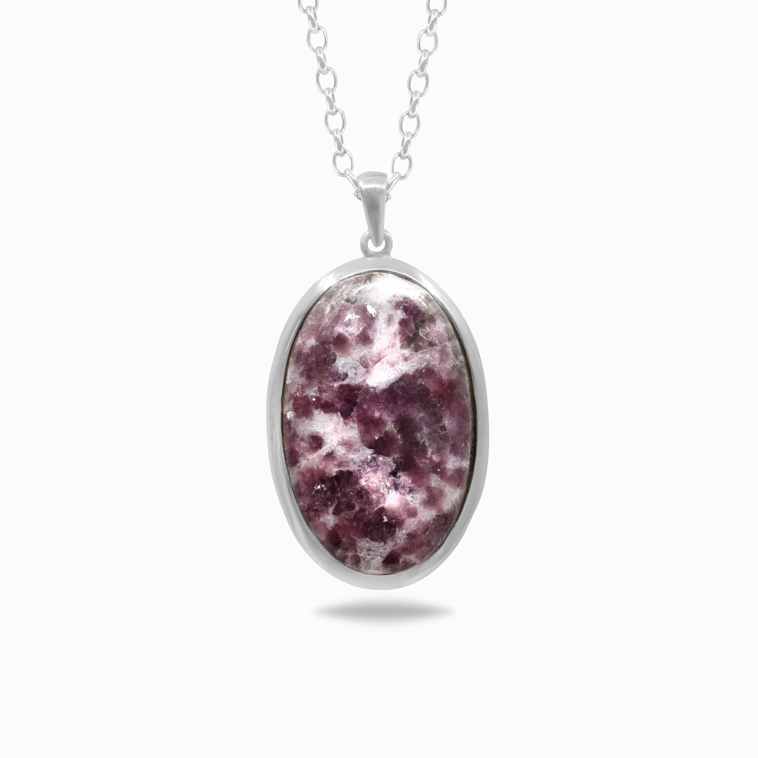 Silver necklace with a pink and white stone pendant on a white background