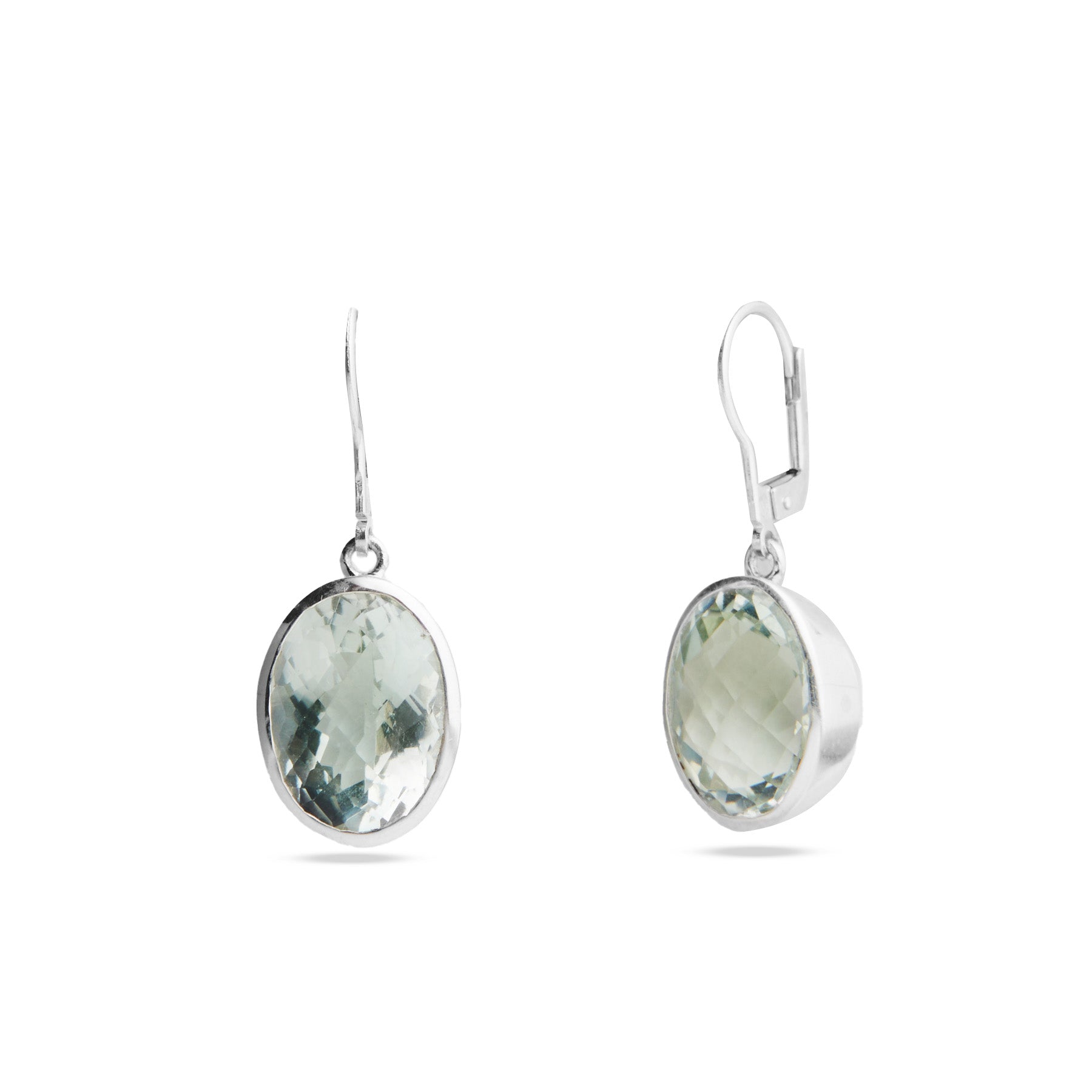 Pair of silver earrings with green gemstones on a white background