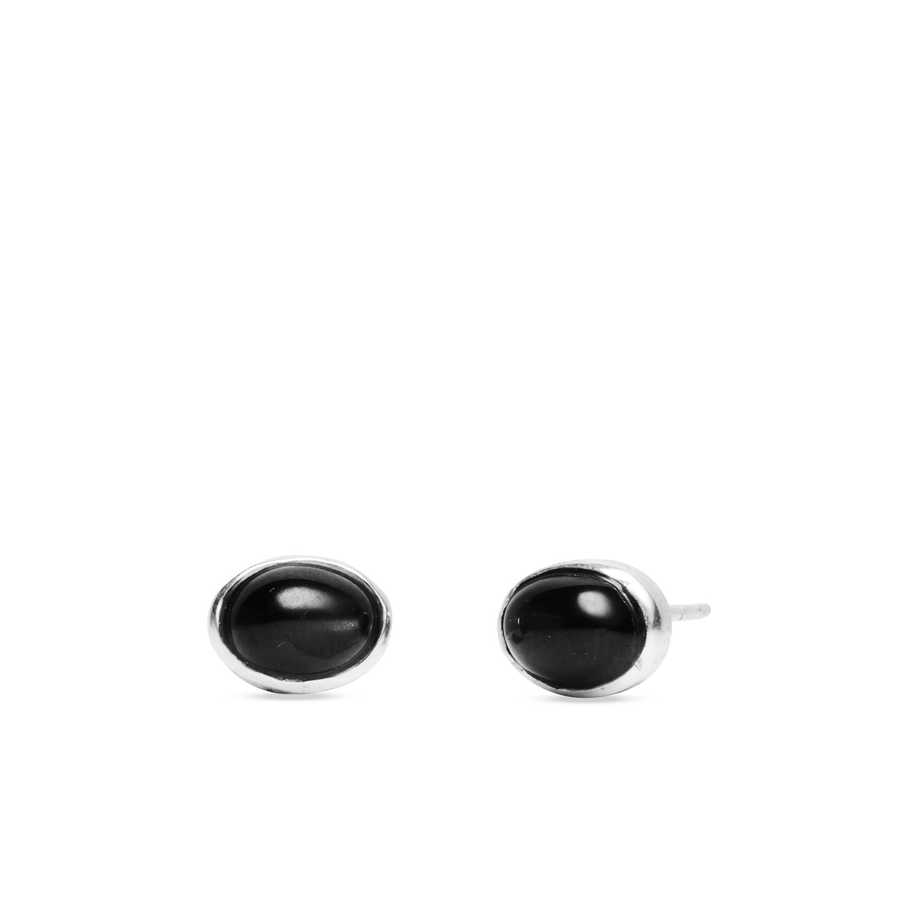 Black oval earrings on a white background
