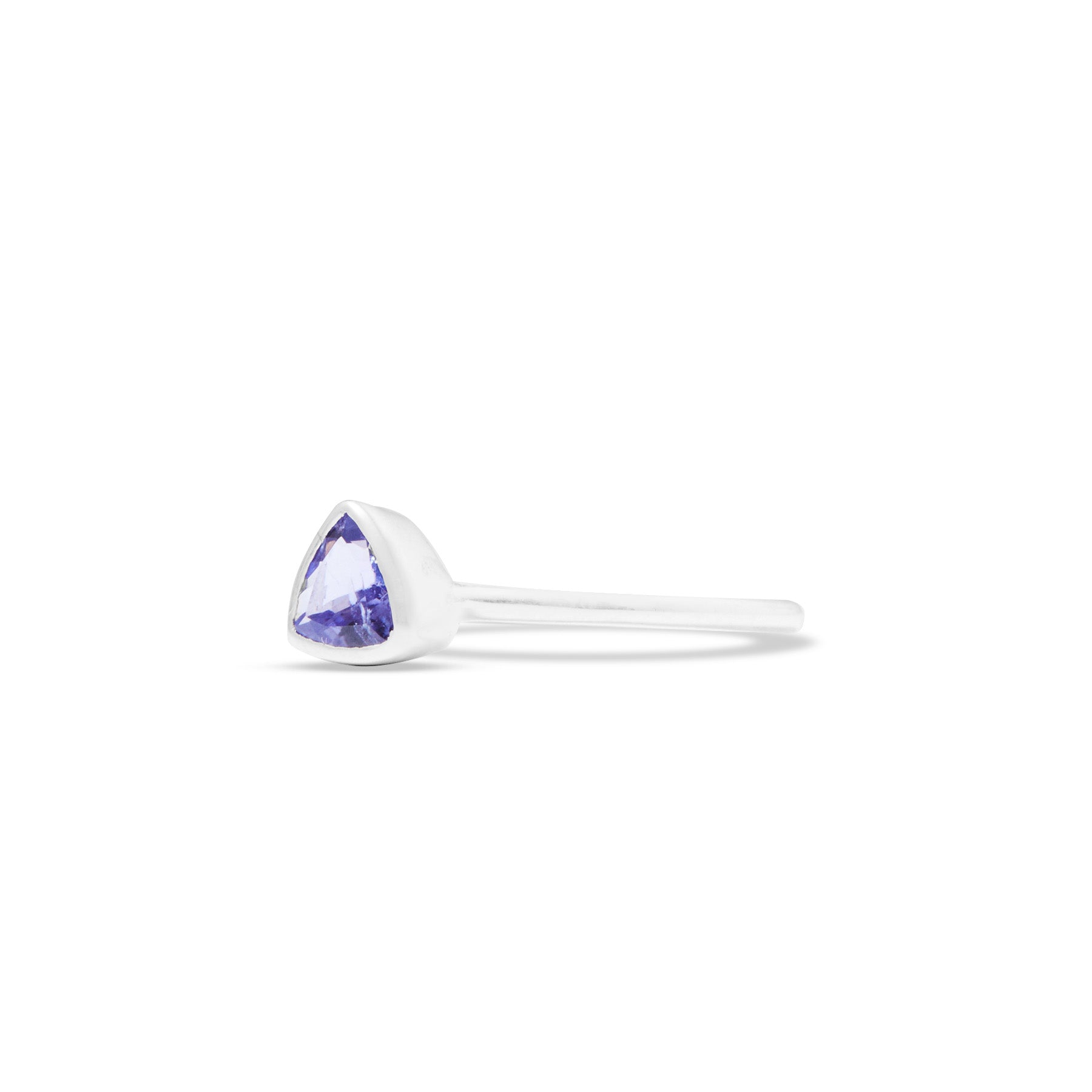 Silver ring with a triangular blue gemstone on a white background