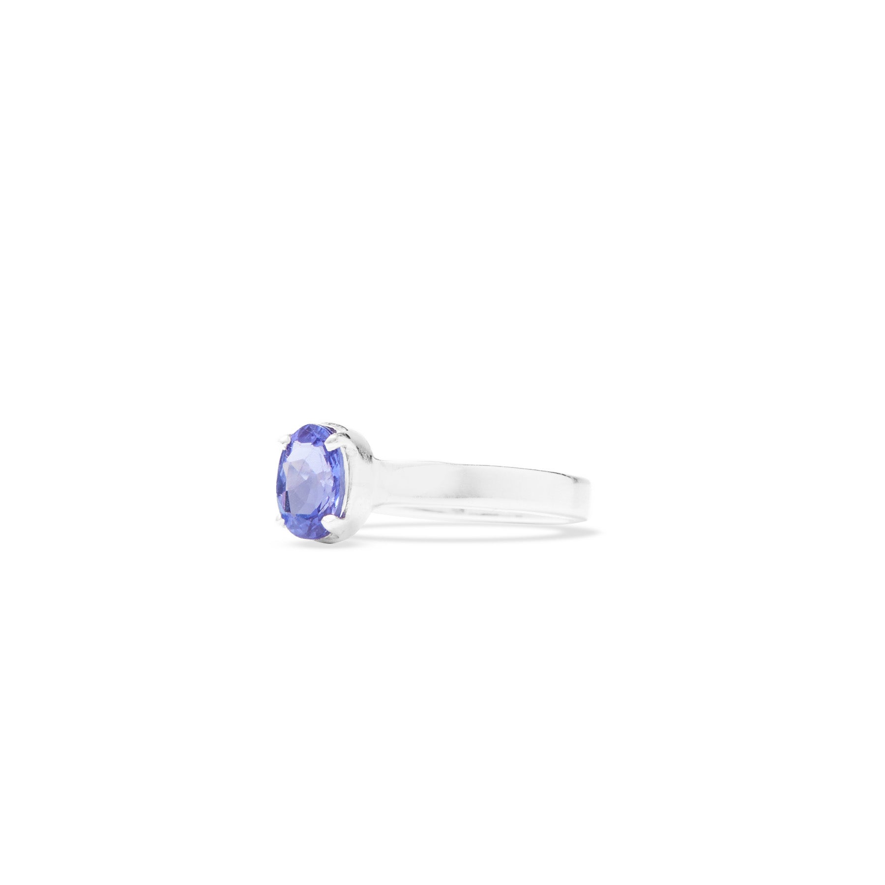 Silver ring with a blue gemstone on a white background