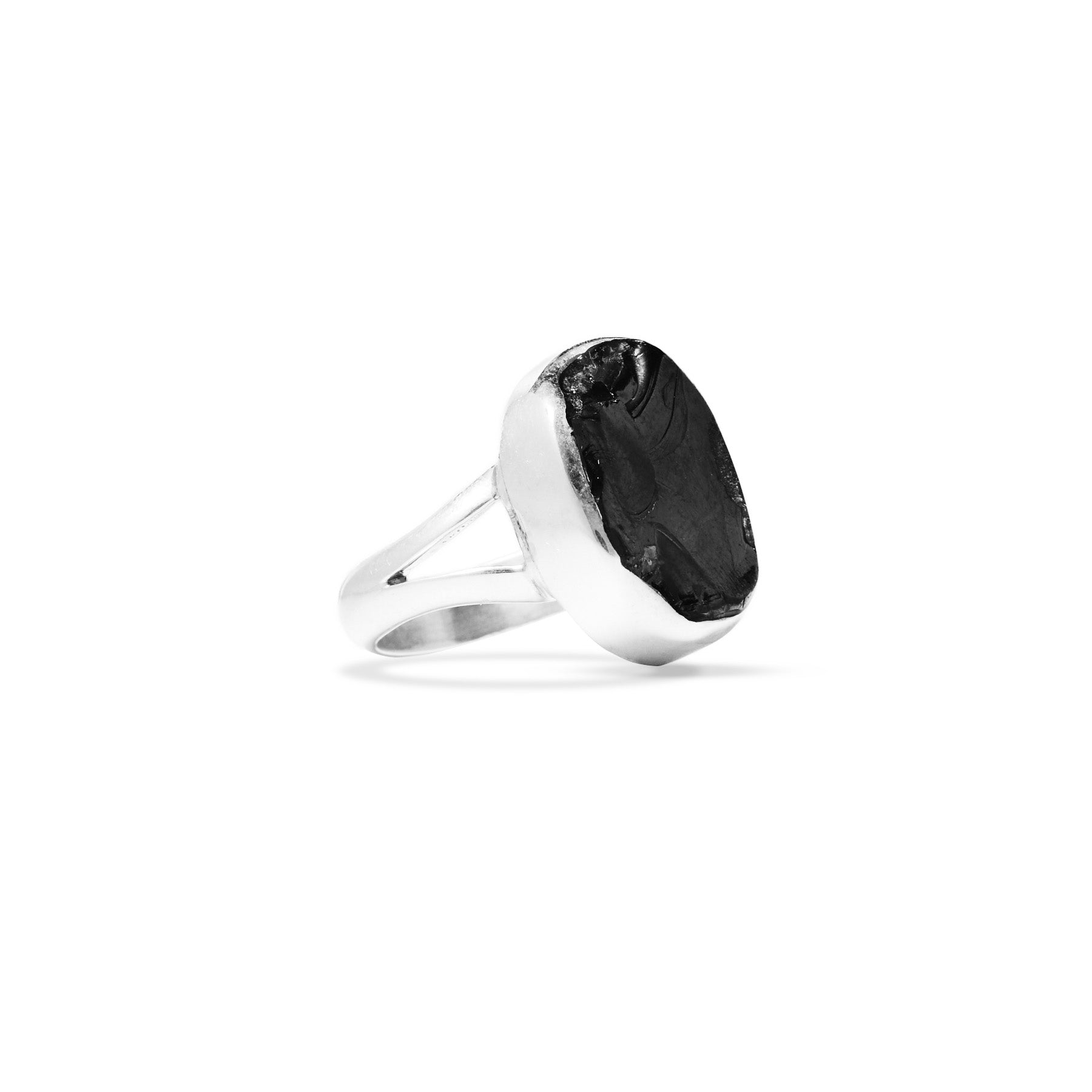 Silver ring with a large metallic stone on a white background