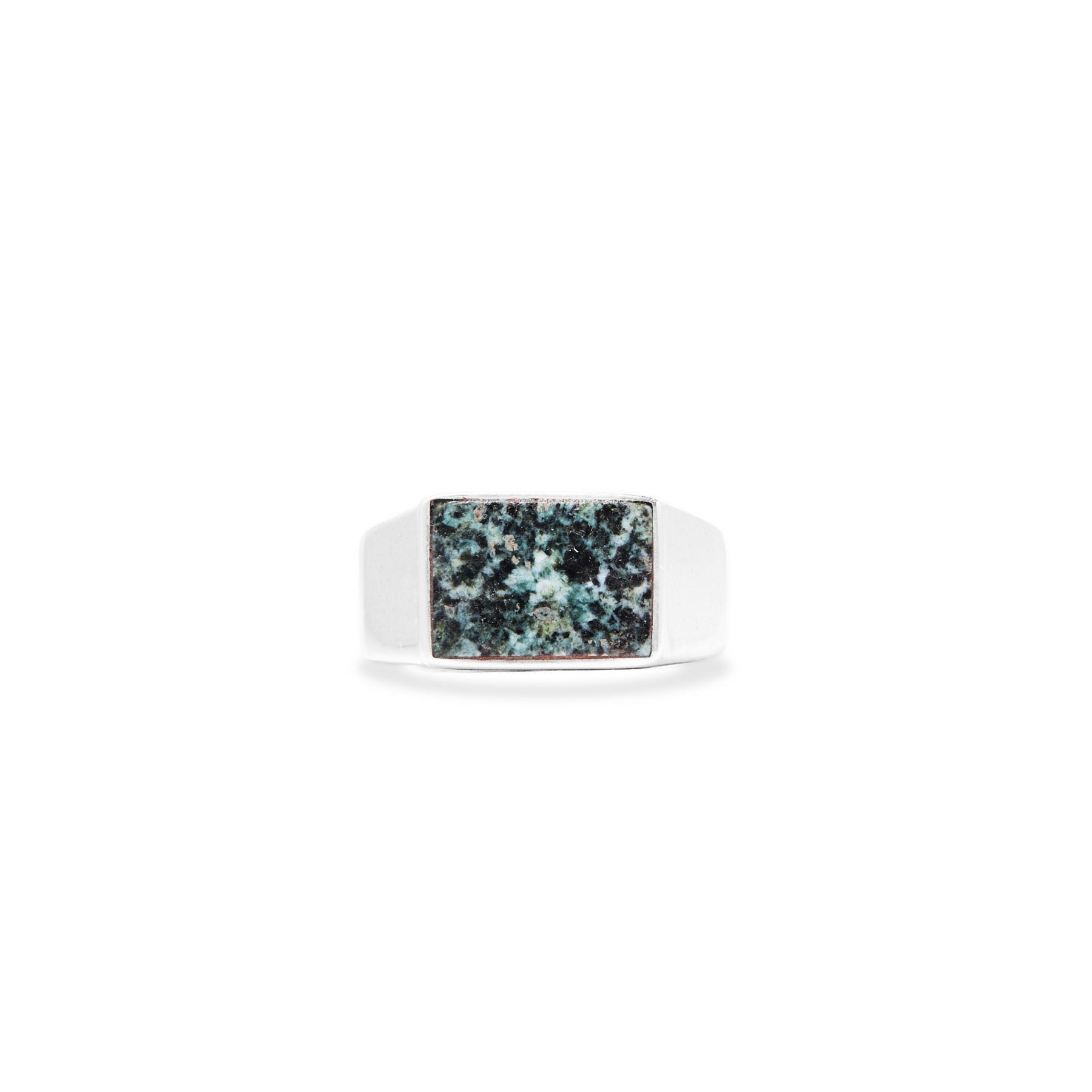 Silver ring with a rectangular green stone on a white background