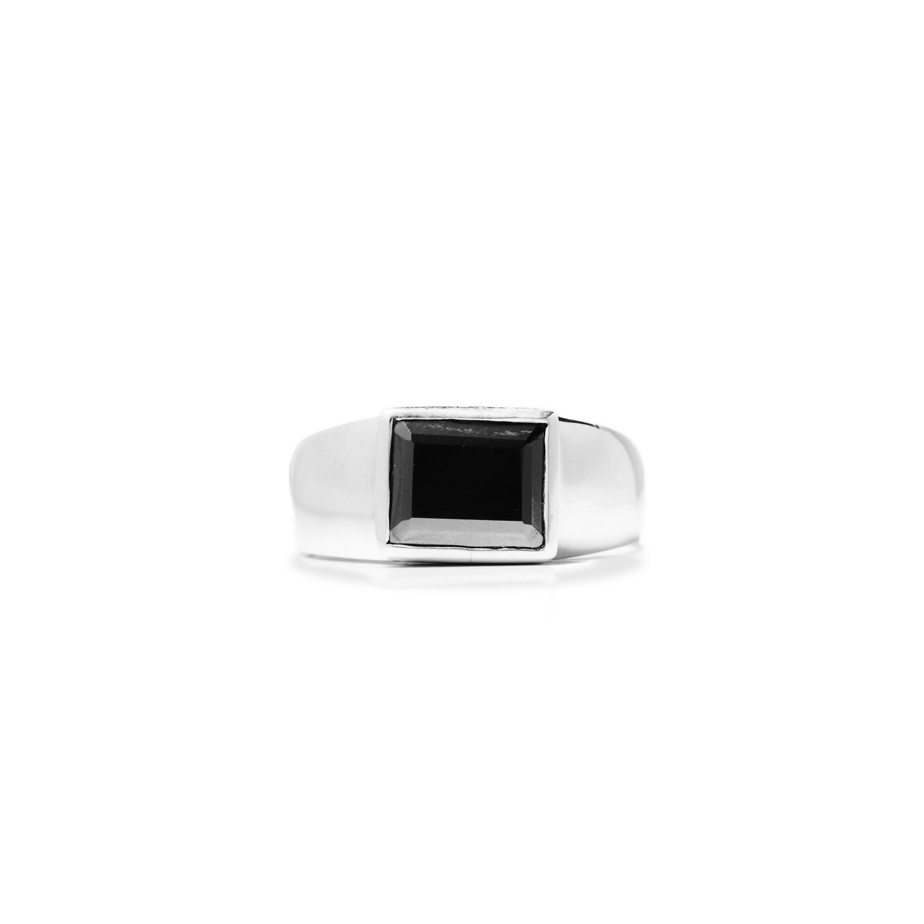 Silver ring with a metallic gemstone on a white background
