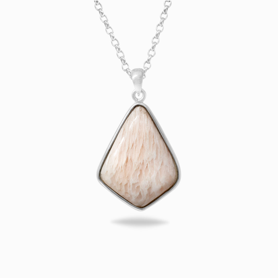 Silver necklace with a light pink gemstone on a white background.