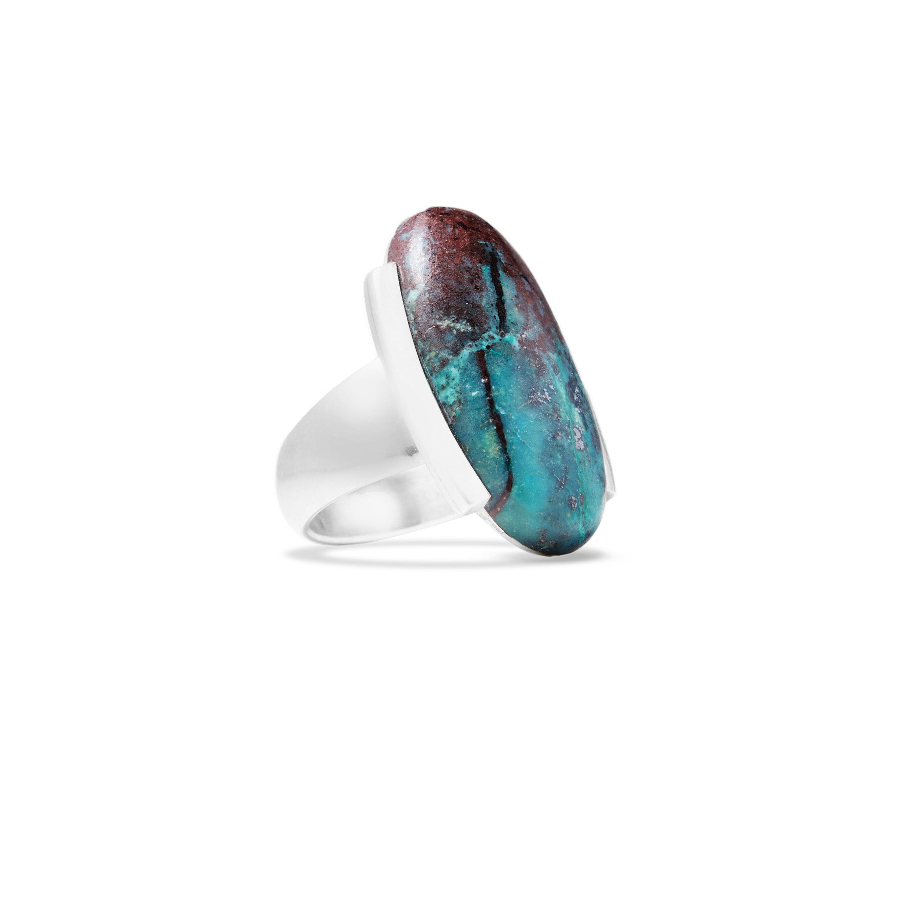 Silver ring with an oval, multicoloured stone on a white background.