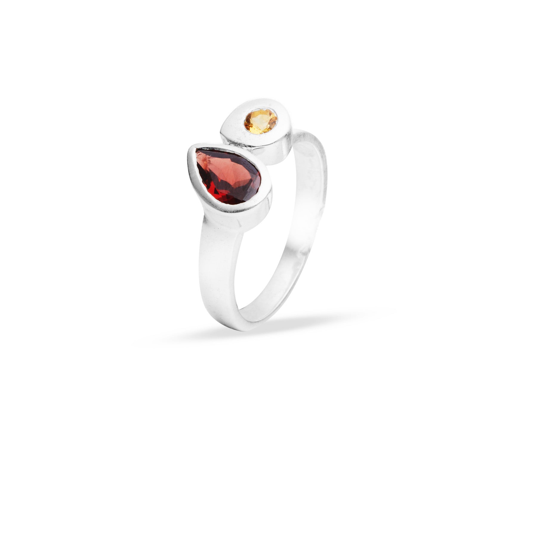Silver ring with red and yellow gemstones on a white background