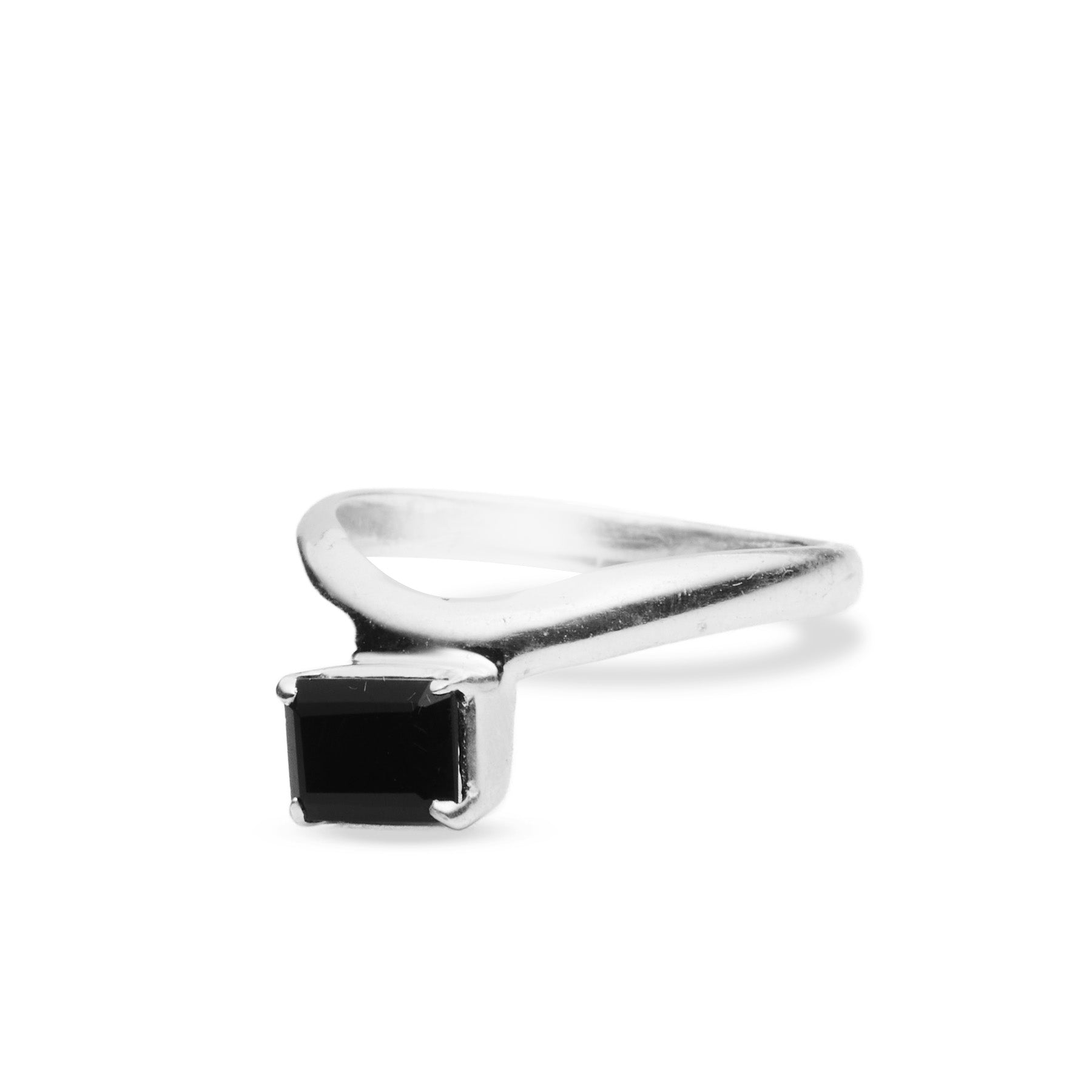 Silver ring with a black gemstone on a white background