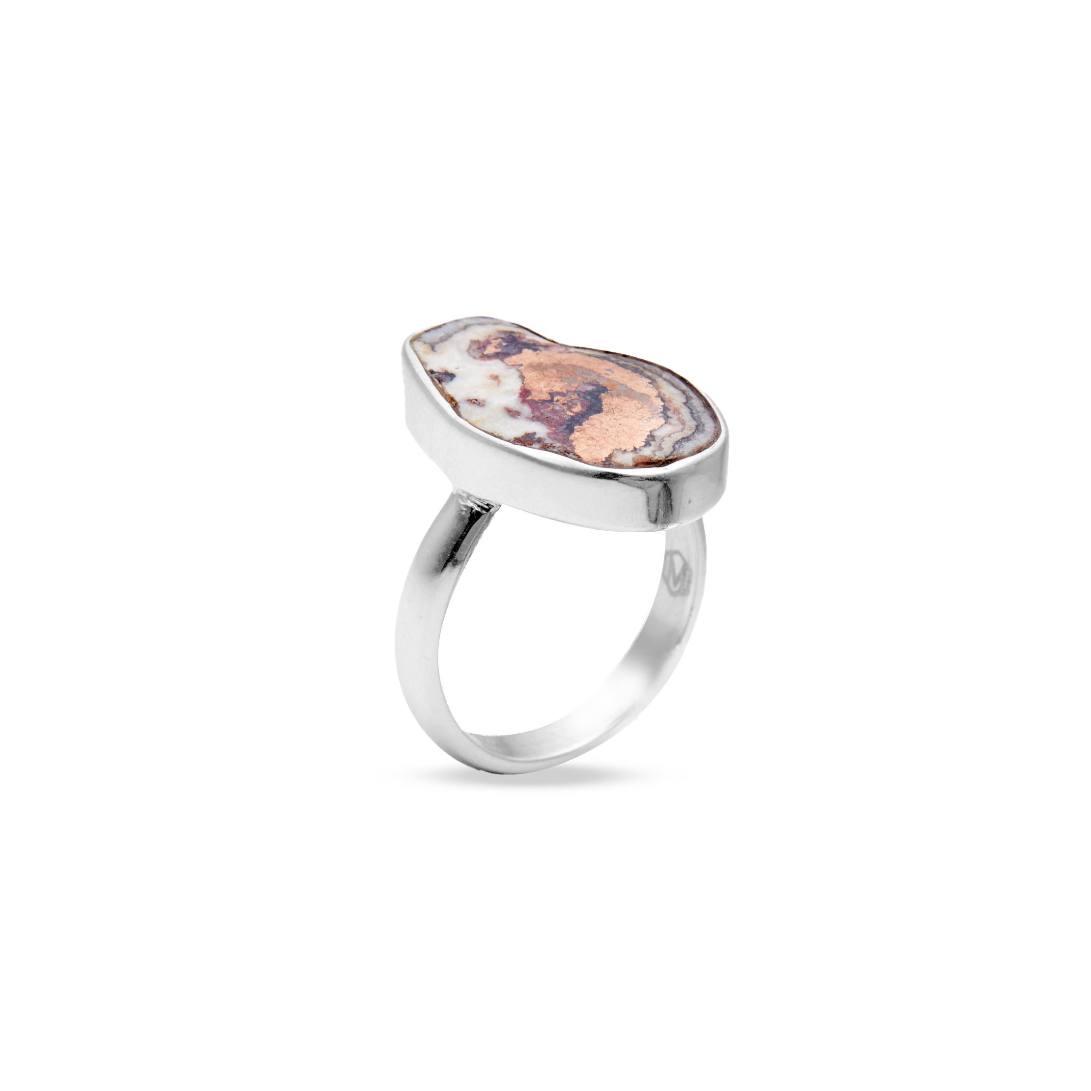Silver ring with a natural stone on a white background