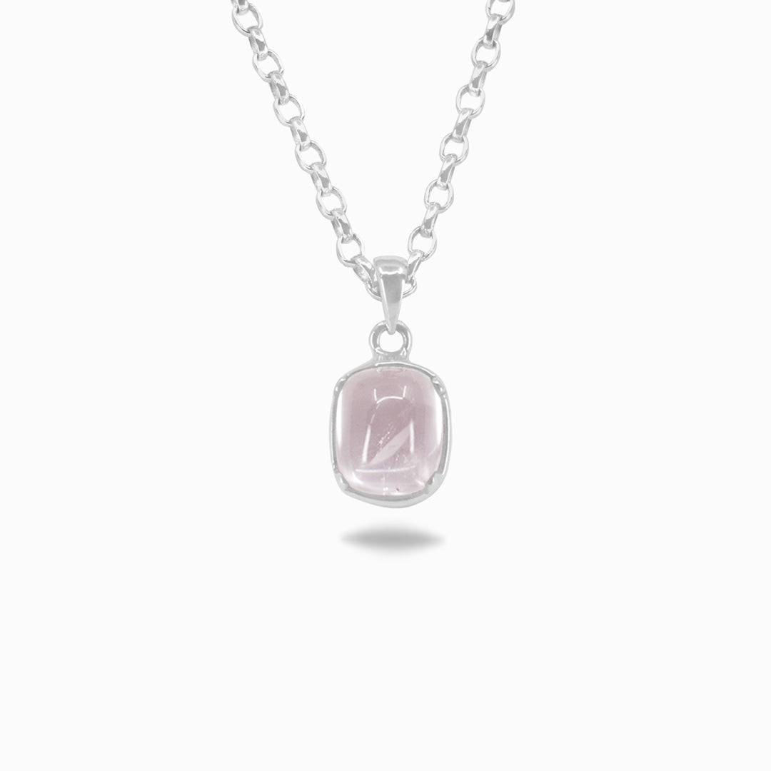 Silver necklace with a pink stone pendant on a white background