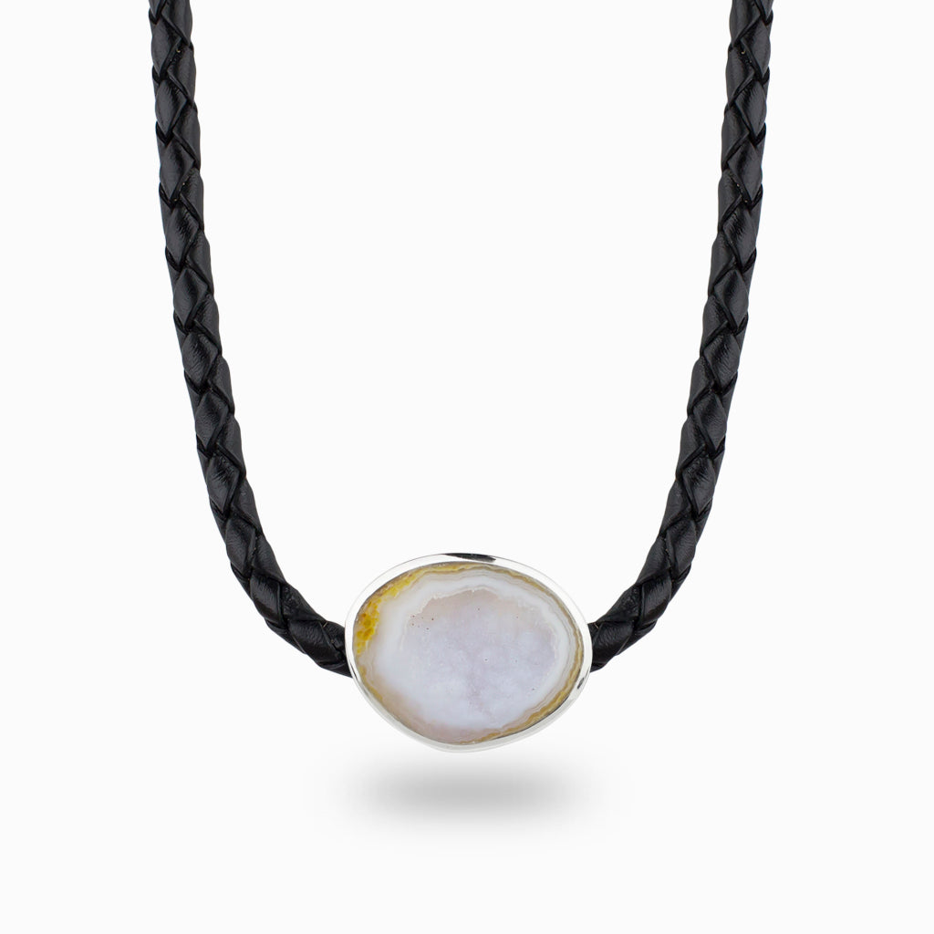 pale pearly pink agate in a sterling silver bezel set on a plaited leather band