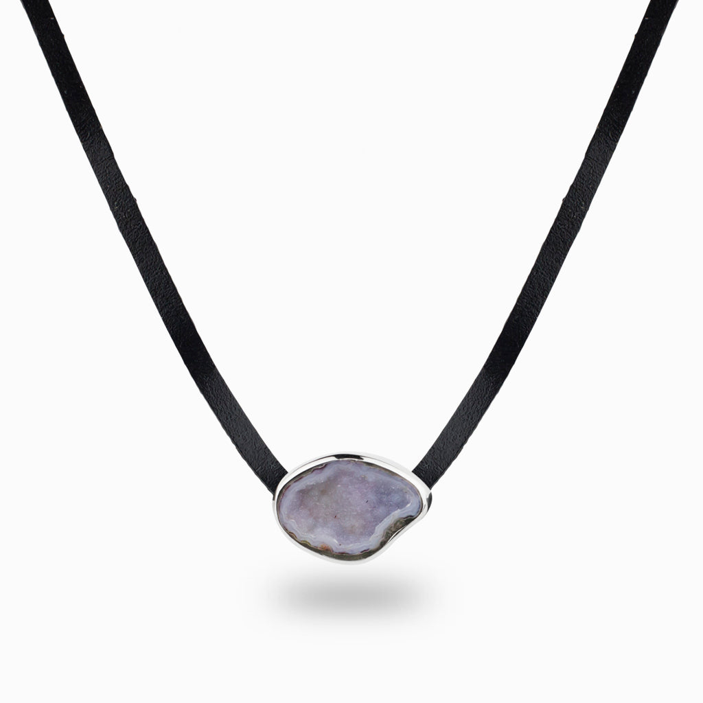 pale purple agate in in a sterling silver bezel, on a plain leather band  