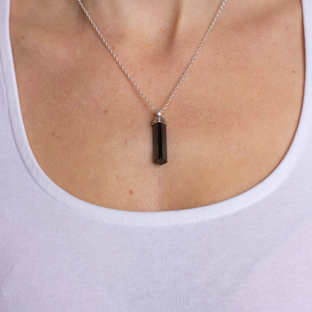 Black tourmaline pencil pendant on model