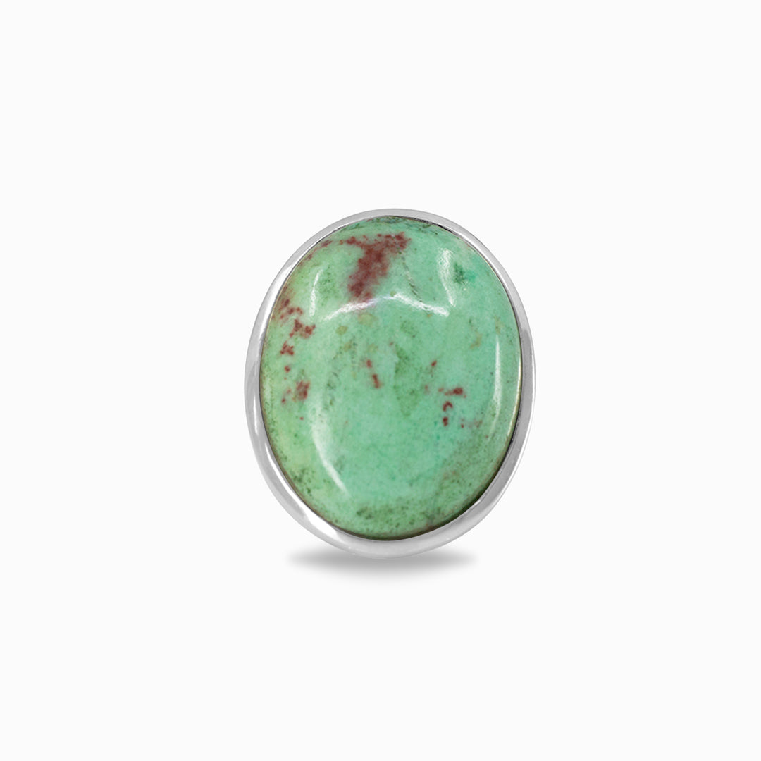 Silver ring with green and red gemstone on a white background