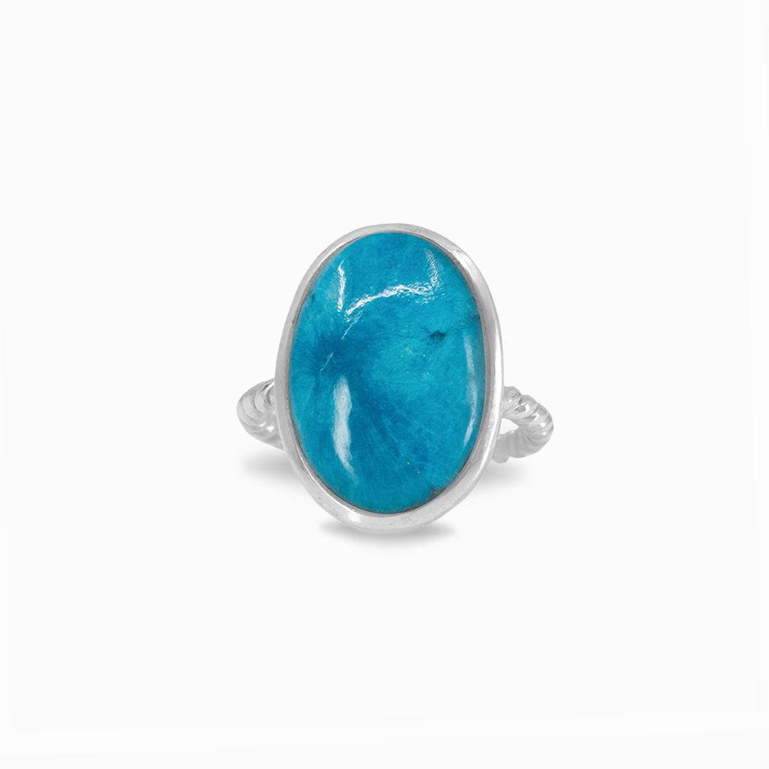Silver ring with a blue gemstone on a white background