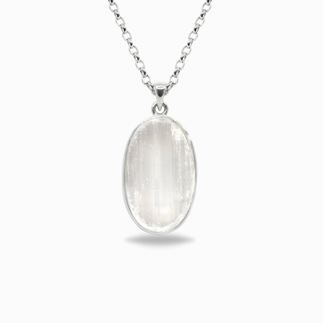 Silver necklace with a white stone pendant on a white background